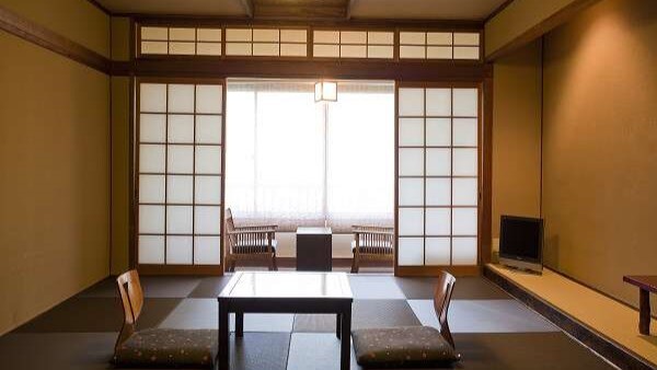 A simple Japanese-style room lit by washi paper