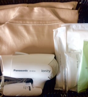 Linens handed over at the front desk (sleeping gown, toothbrush, comb shaver)