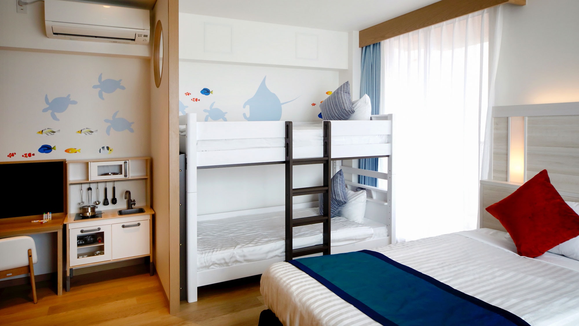 [Main Building/Family Room B Type] A room with a playful layout, such as blackboards and wall art.