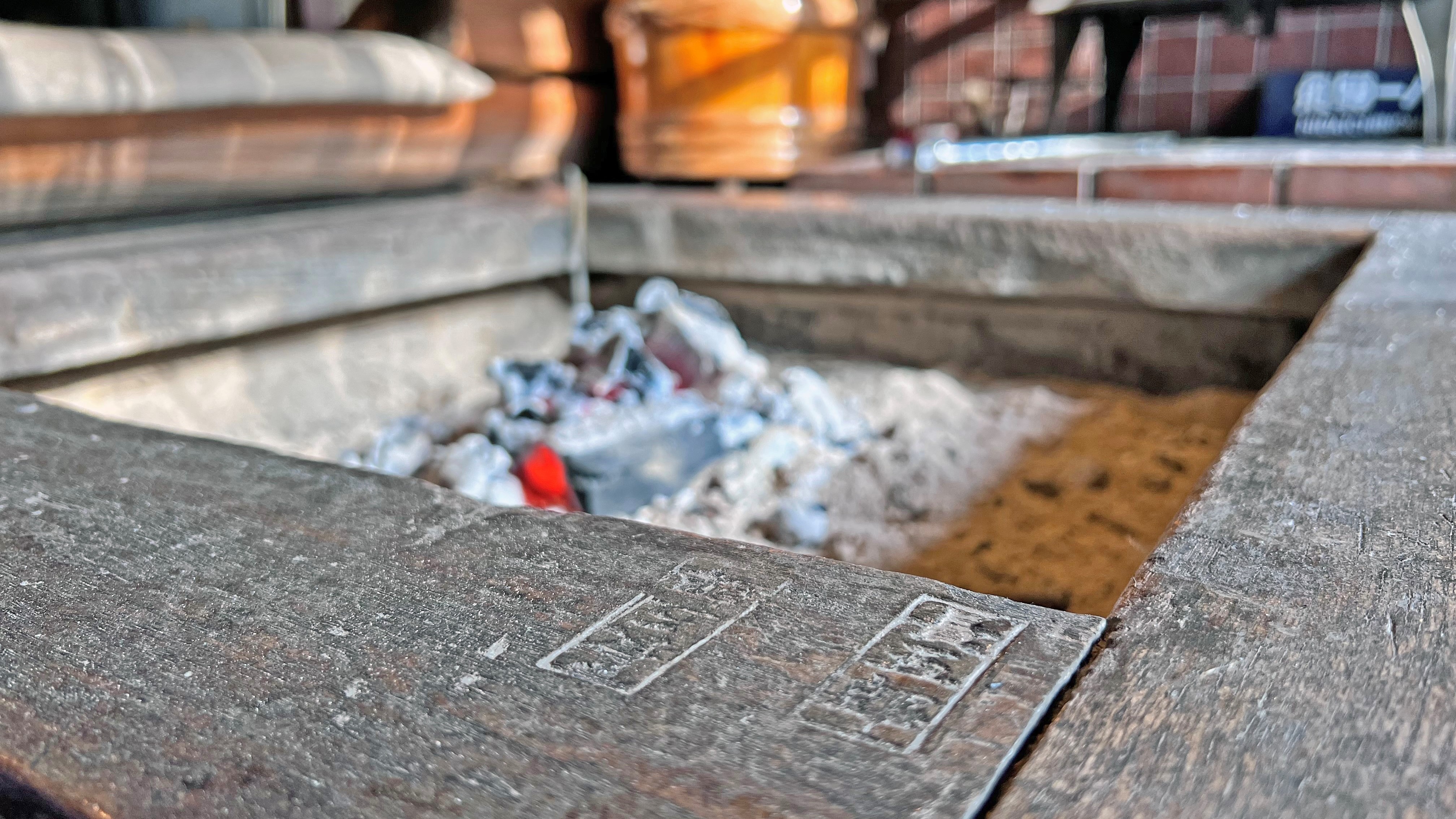 Between the hearth, there is the smell of warm charcoal and the crackling of fire.