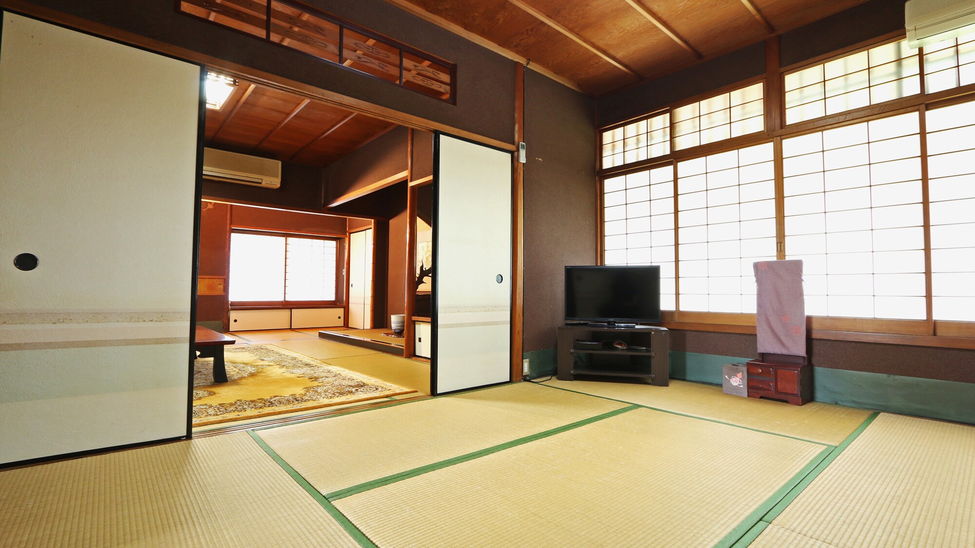 A spacious guest room with two adjoining rooms, each measuring 6 tatami mats and 8 tatami mats.