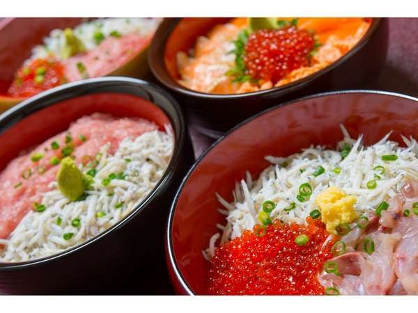 Bowl of rice topped with sashimi