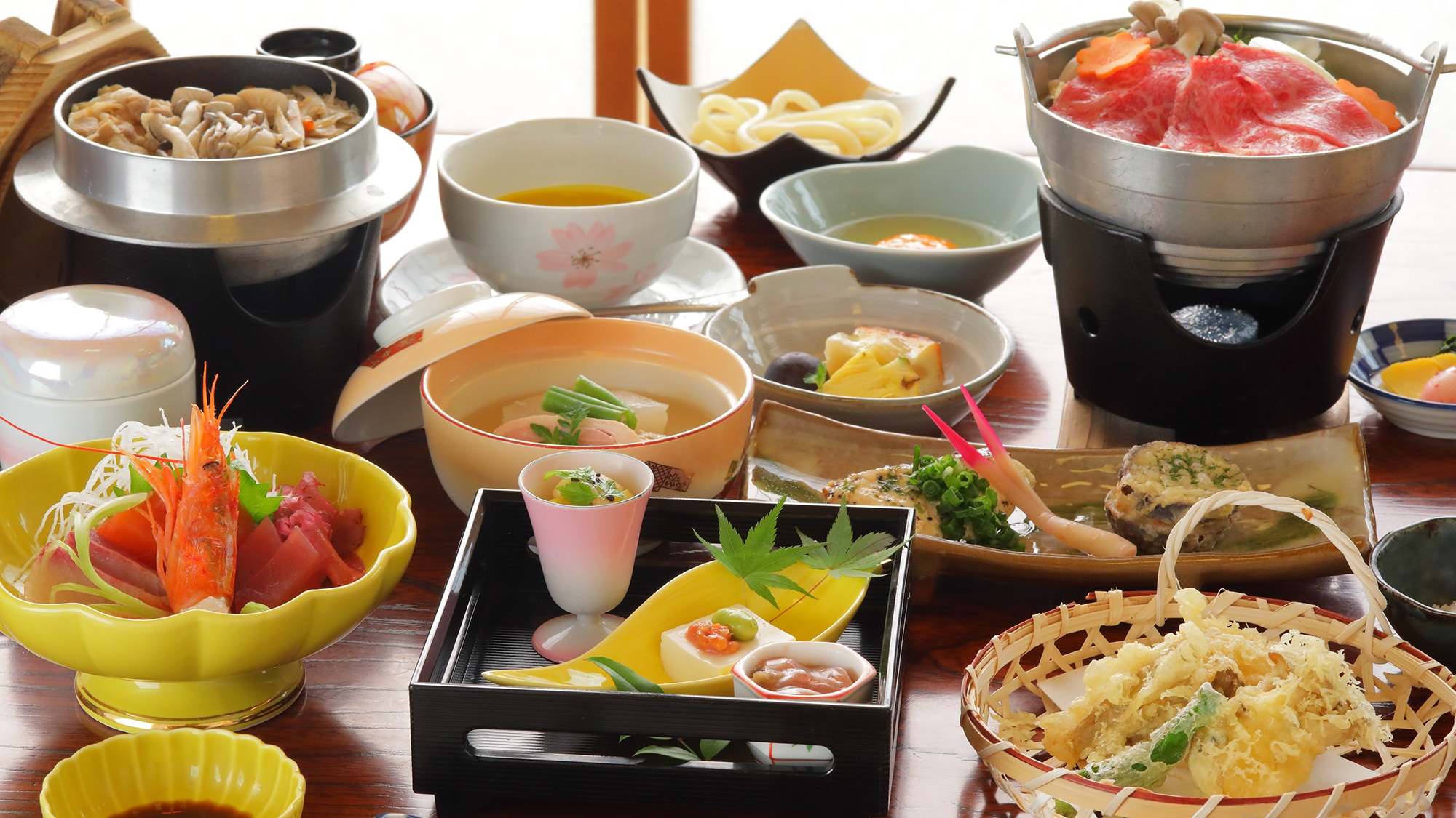 Dinner (standard) example: A colorful array of dishes with local Ashitaka beef as the main dish