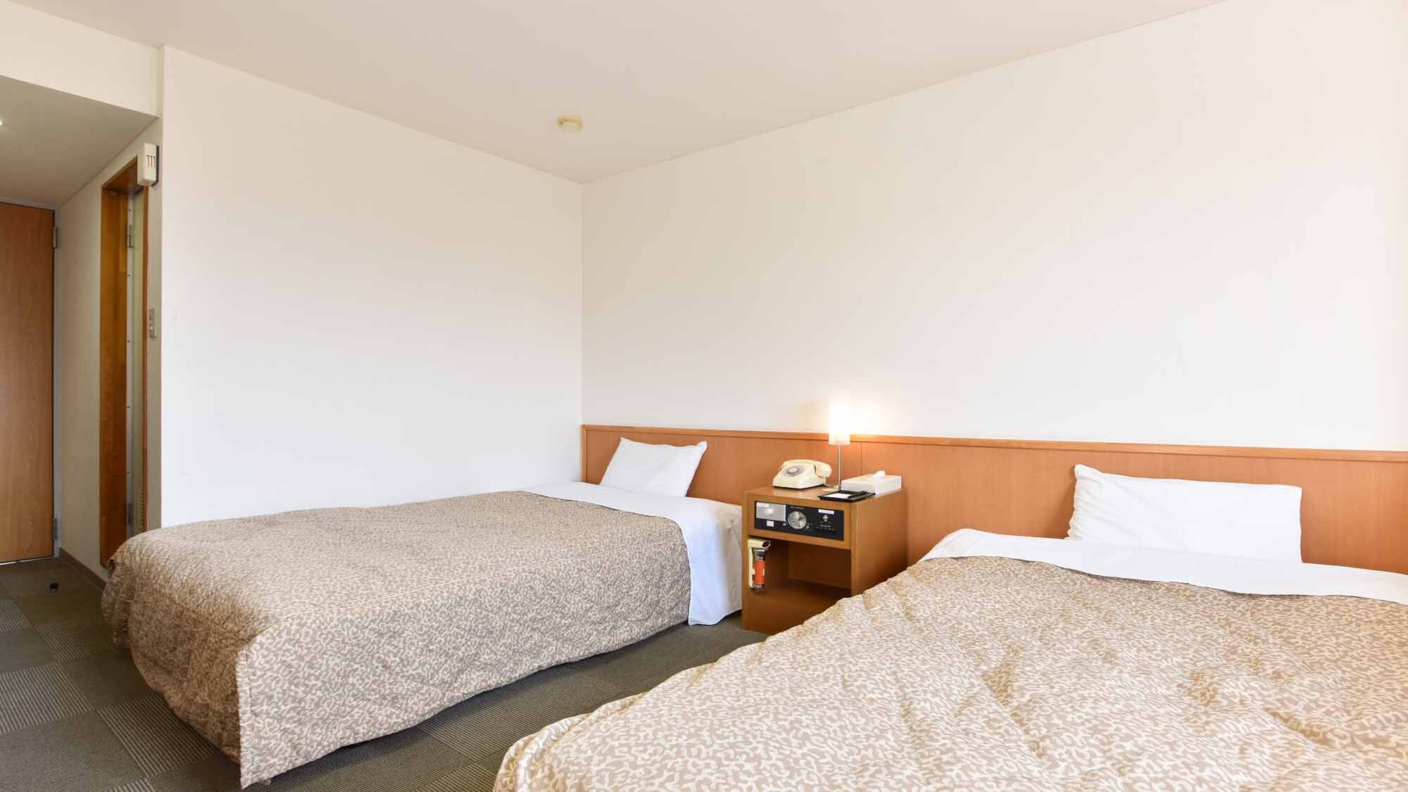*[Example of guest room] Twin room (with bathroom and toilet) / Free Wi-Fi connection available in all rooms.