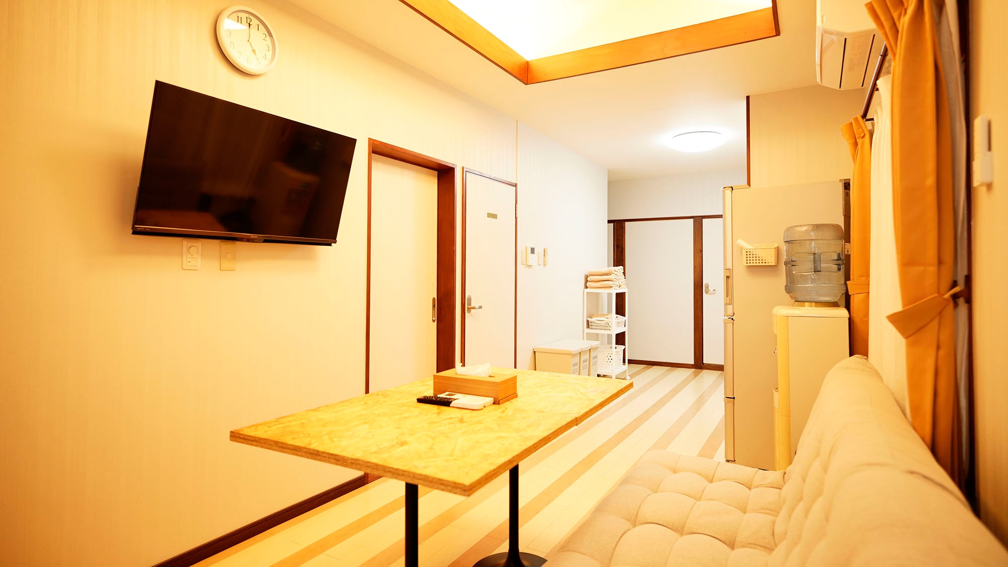 ・Room 201: A brightly lit and warm living room