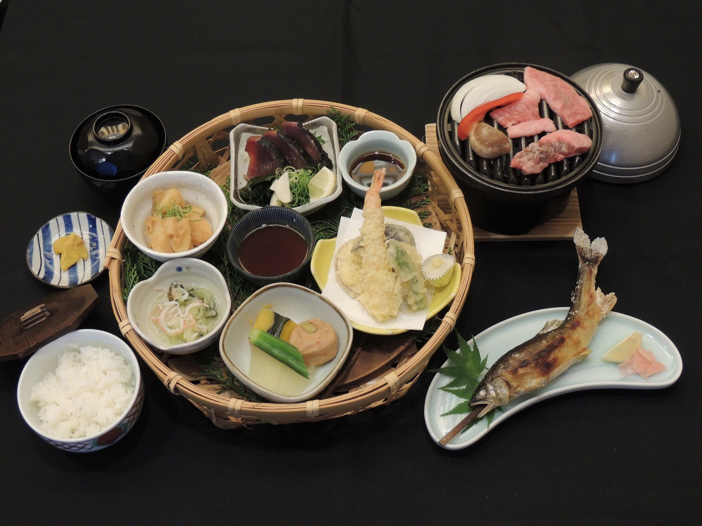 Hanagozen set meal with Tosa Black Beef, raised in the Shikoku Karst region and characterized by its melt-in-your-mouth fat, served on a ceramic platter