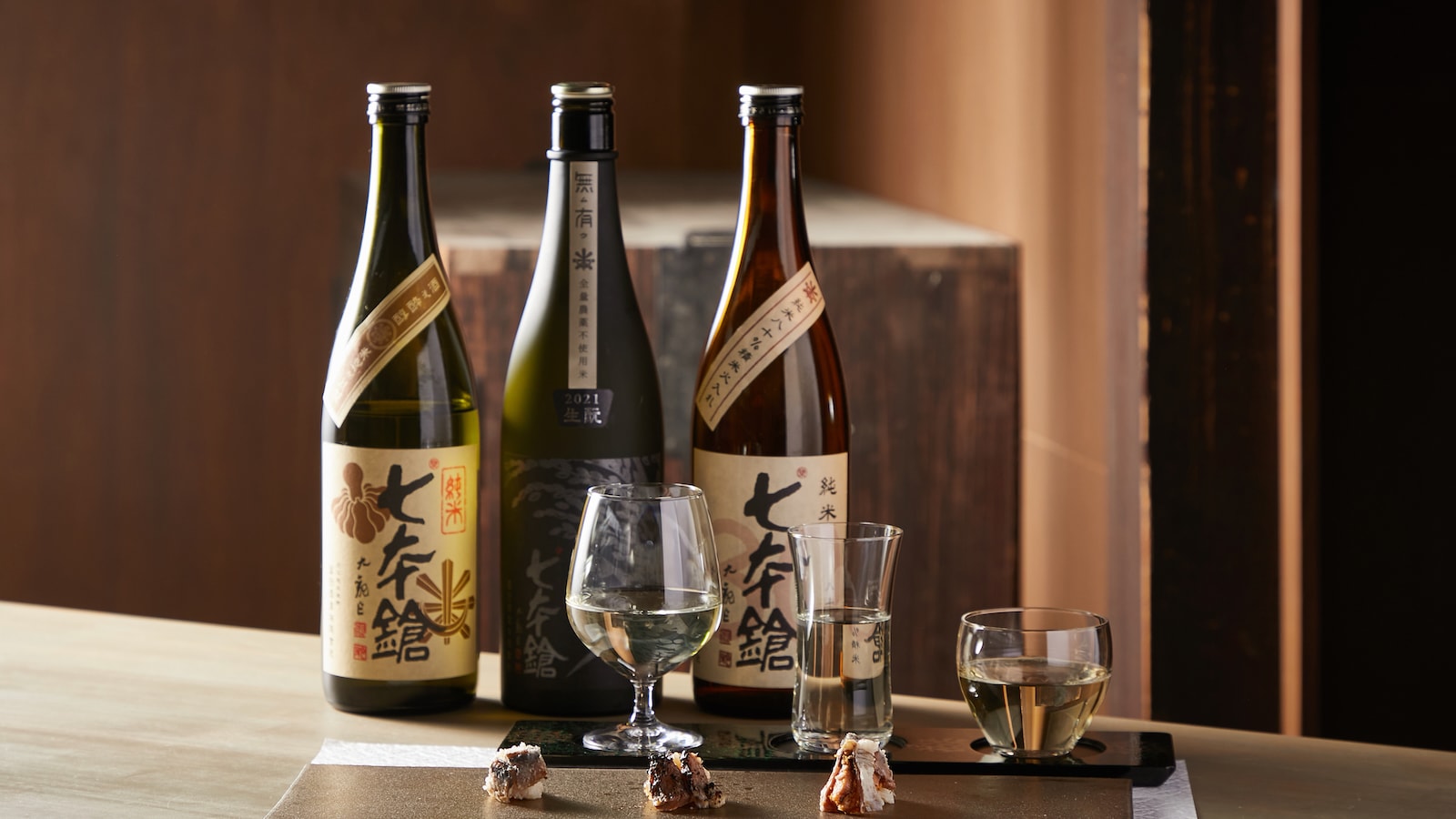 Experience pairing three types of sushi - seared, raw, and seasonal aged sushi - with Nagahama's local sake, Shichihonyari.