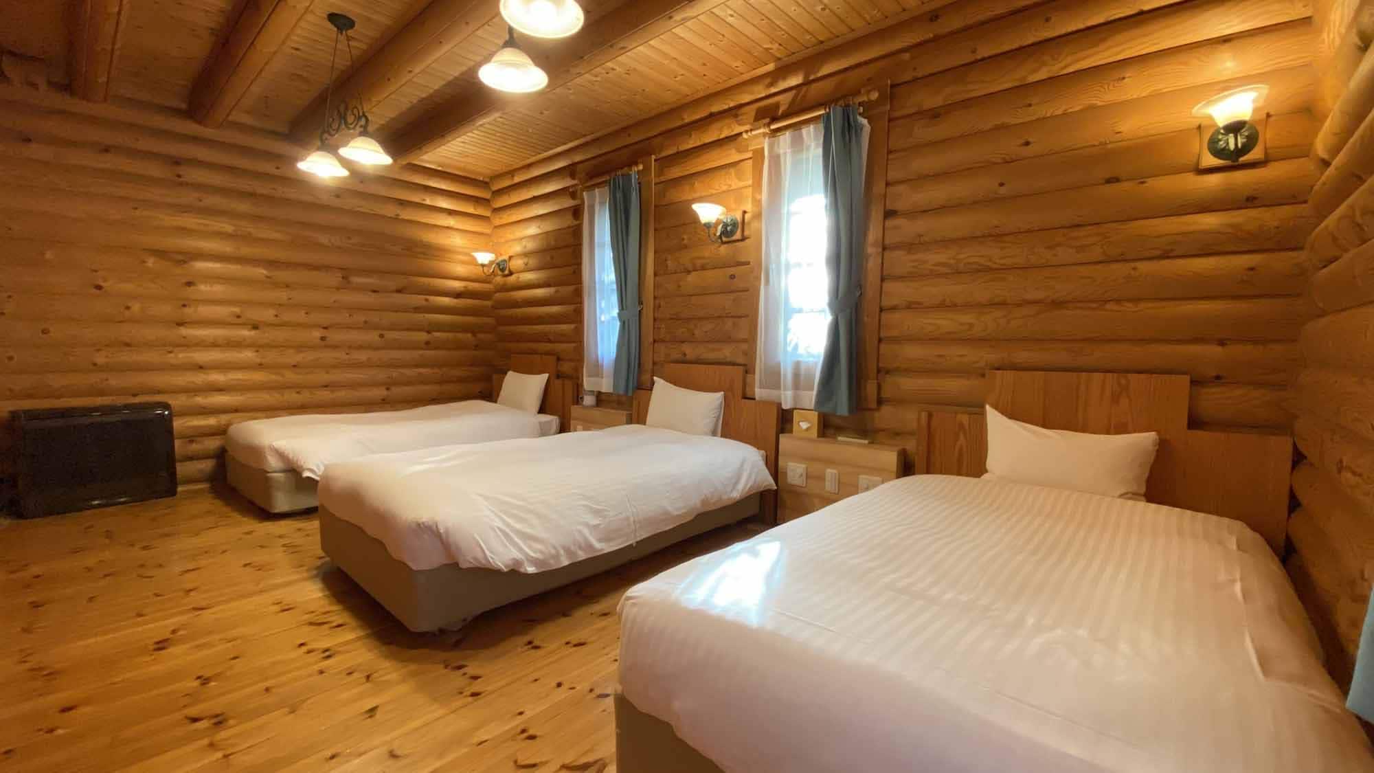 * [Log house Premium Large] 1st floor bedroom. There is also a convenient outlet on the bedside.