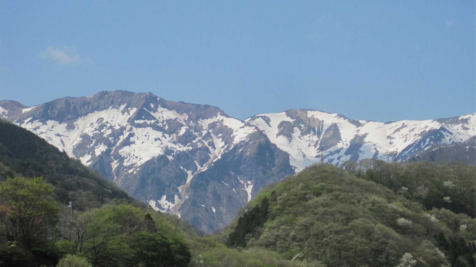 View from the guest room overlooking the hot spring town and mountains