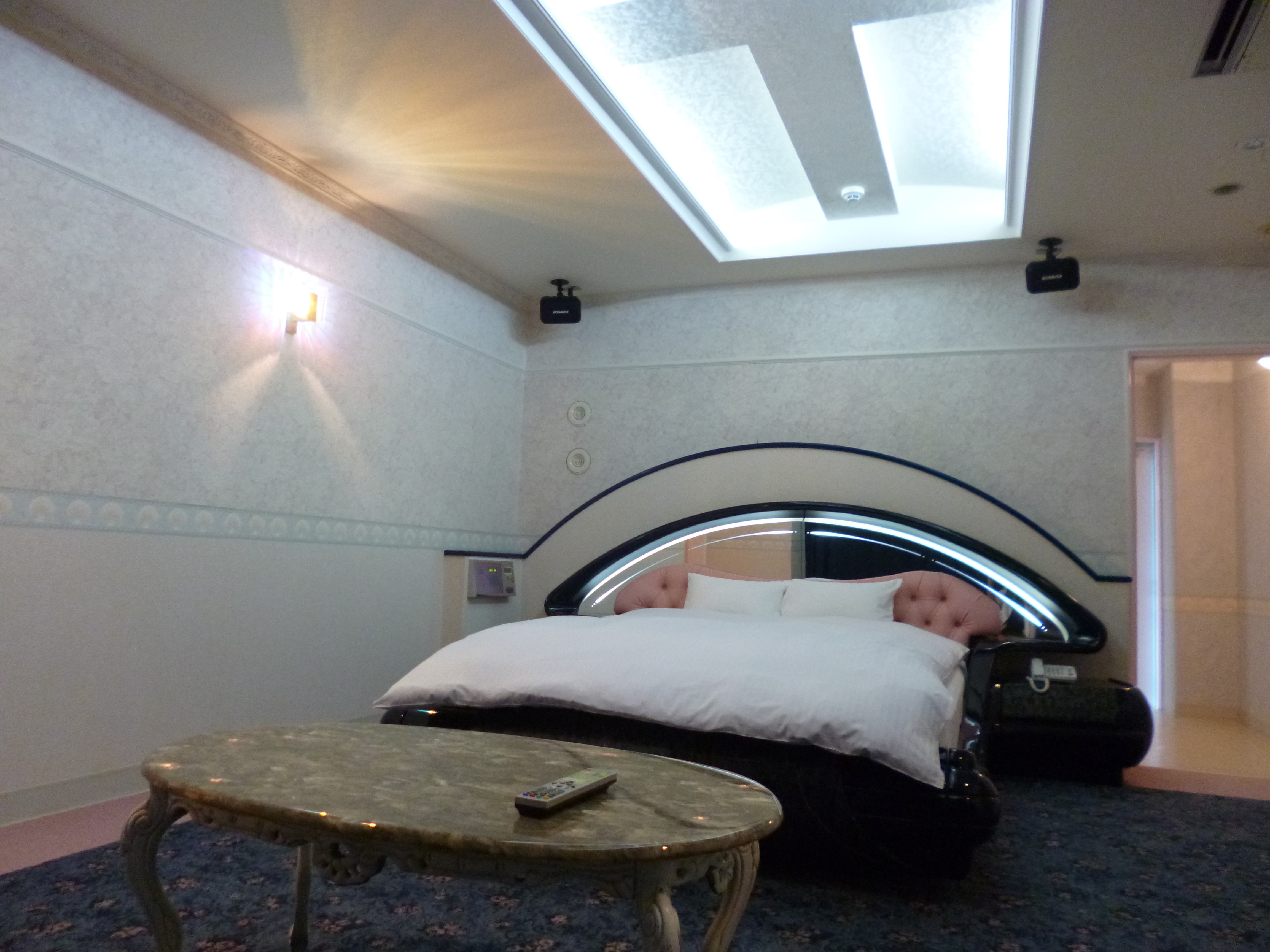 Double room with sofa bed and massage chair