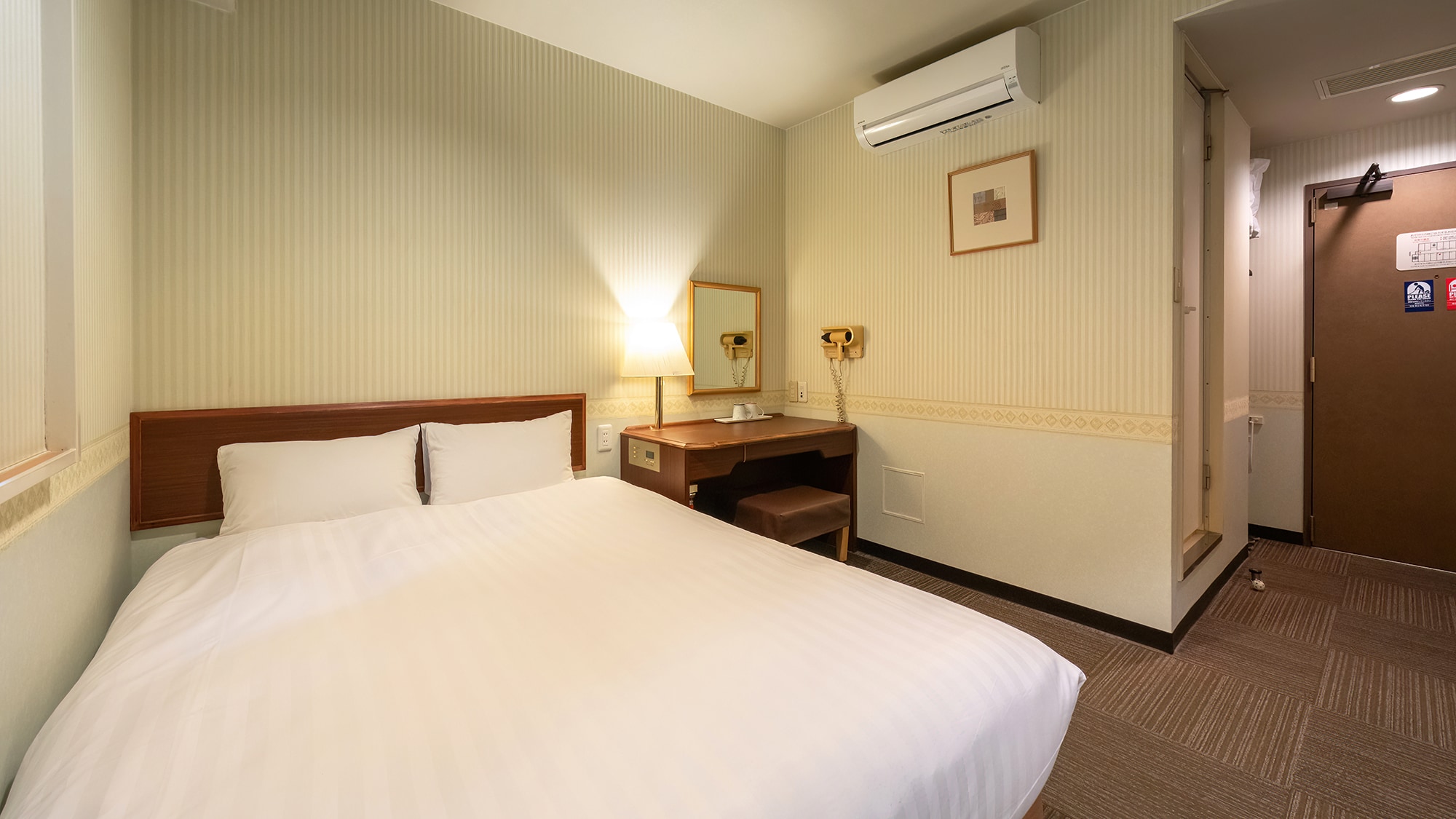 [Double] The large bed offers luxury and comfort for one person or for two.