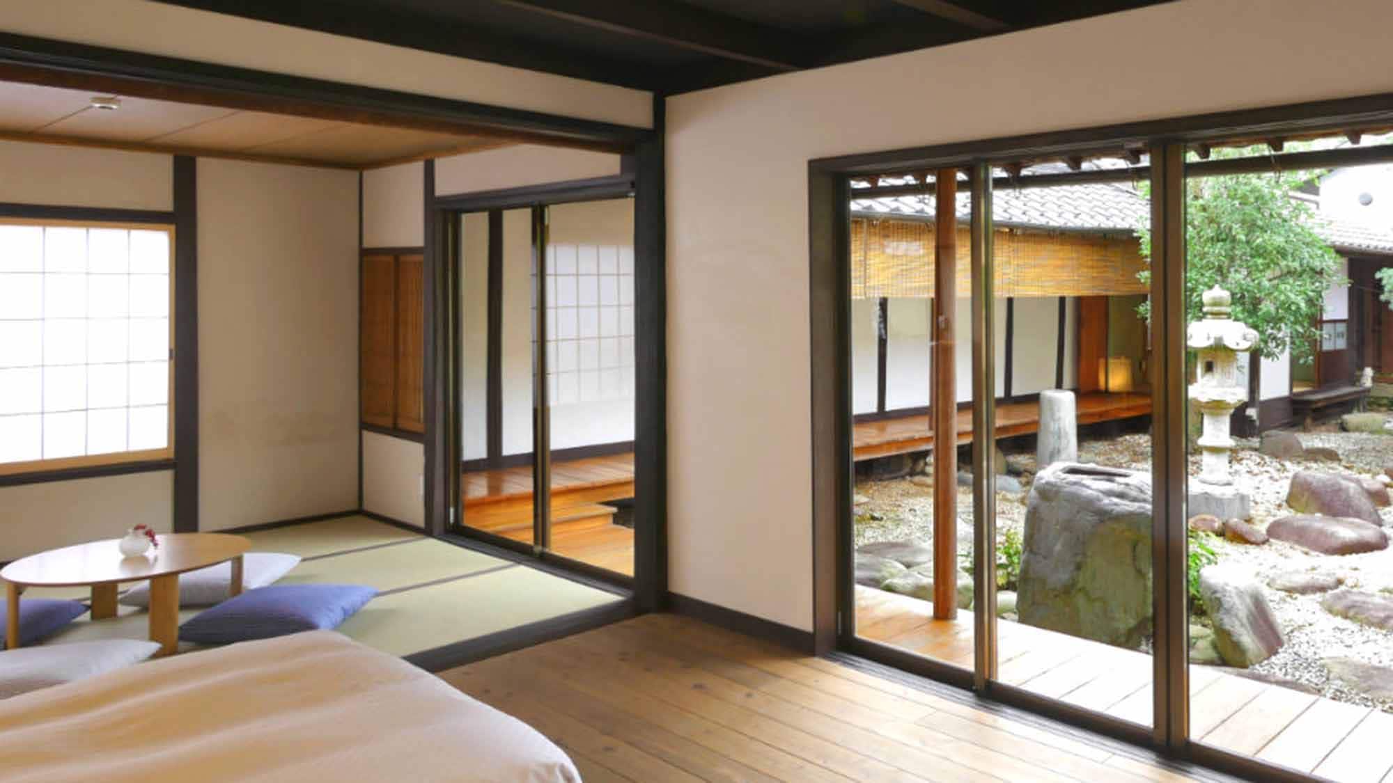 This room features a large window overlooking the courtyard. 2000x1125