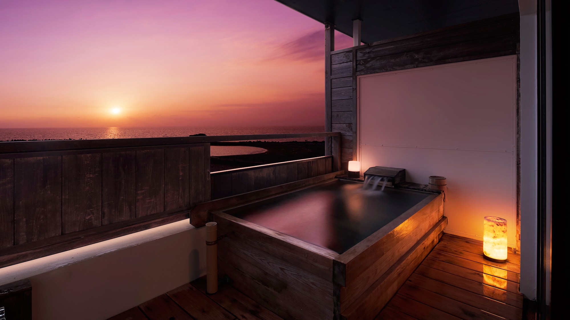 Outdoor bath in guest room and sunset