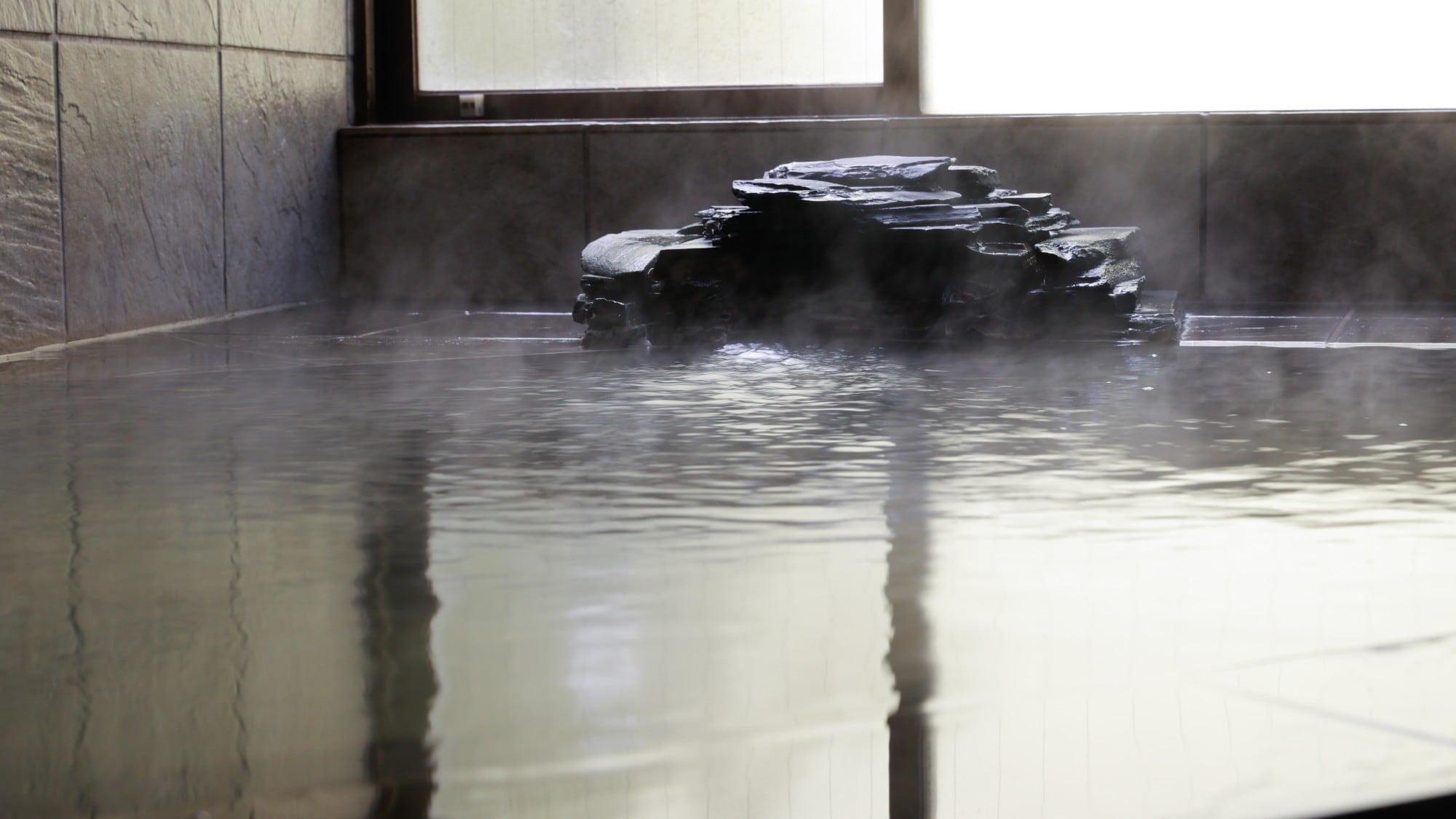 The temperature of the hot spring is 76.4 degrees.