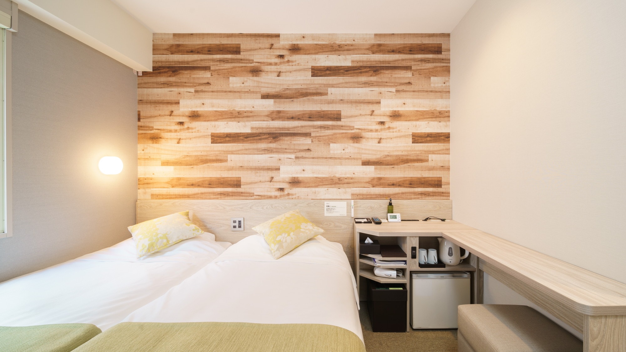 A compact twin room that can accommodate up to two people.