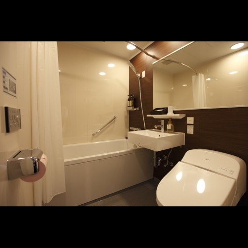 Standard single rooms are 140cm x 180cm and feature a spacious bathroom with a wide mirror (toilet and sink combined).