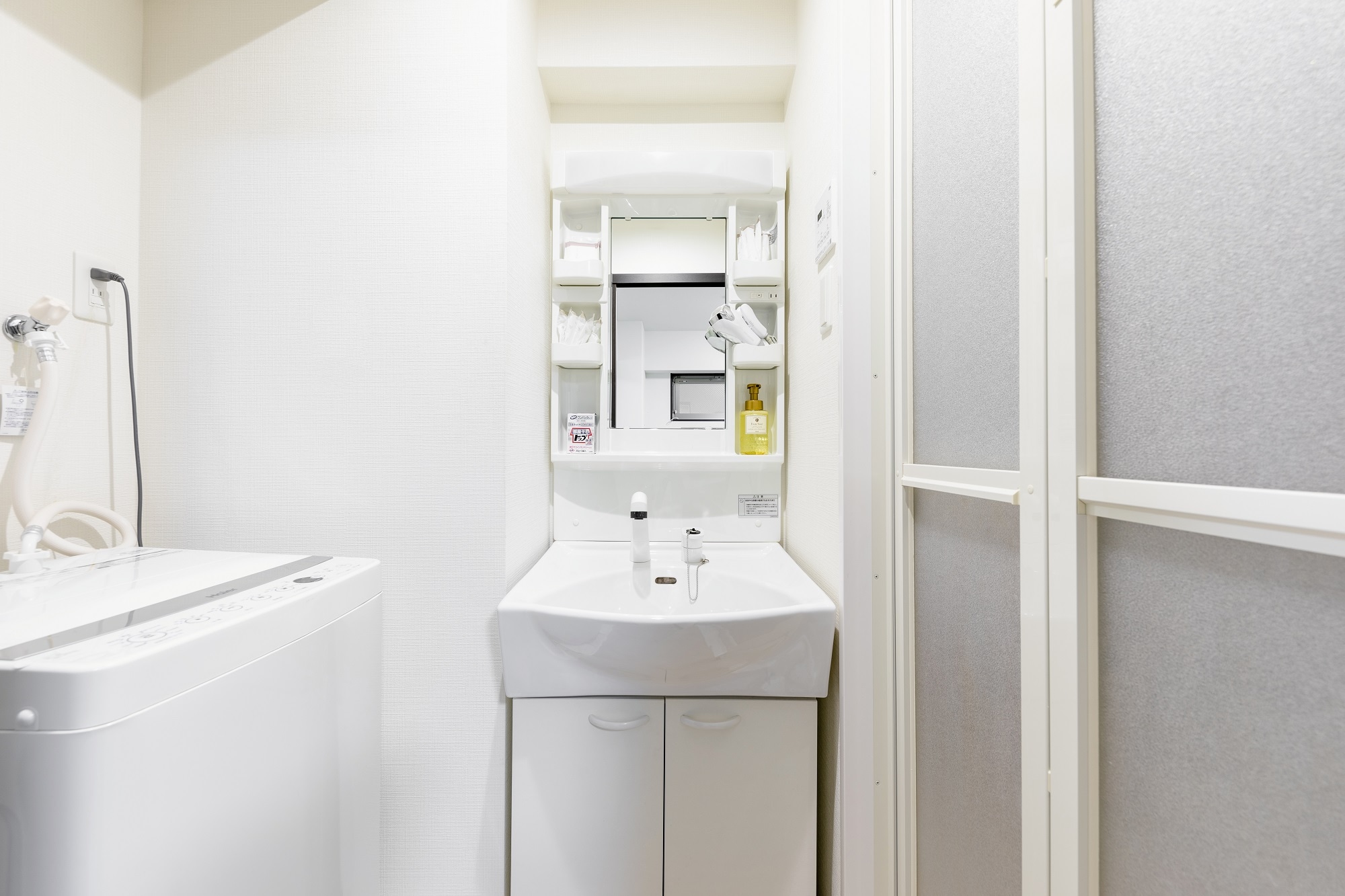 There is also a washing machine next to the sink. No need to worry if your clothes get dirty.