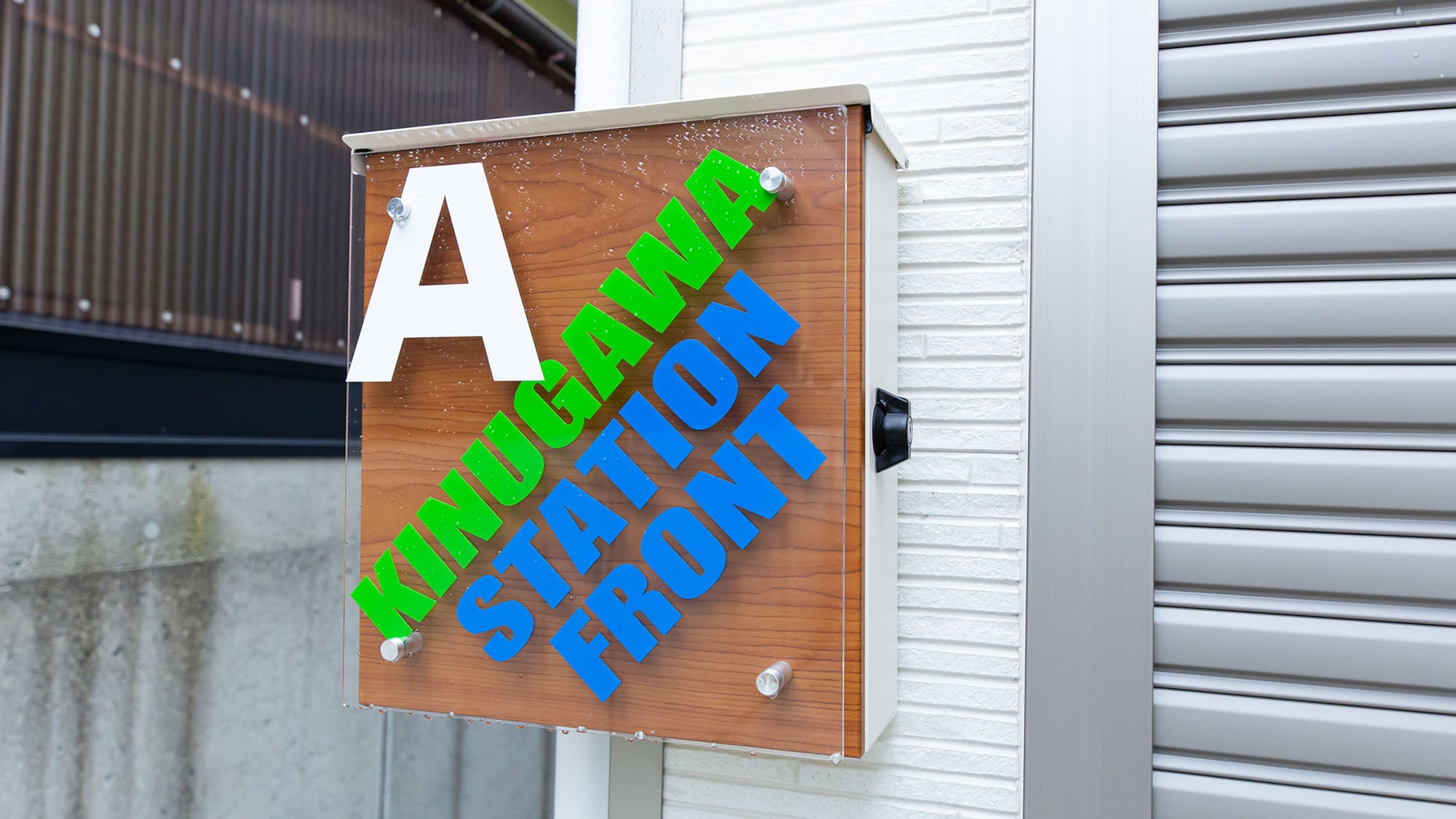 [Building A, Signboard] Please use this signboard as a landmark.