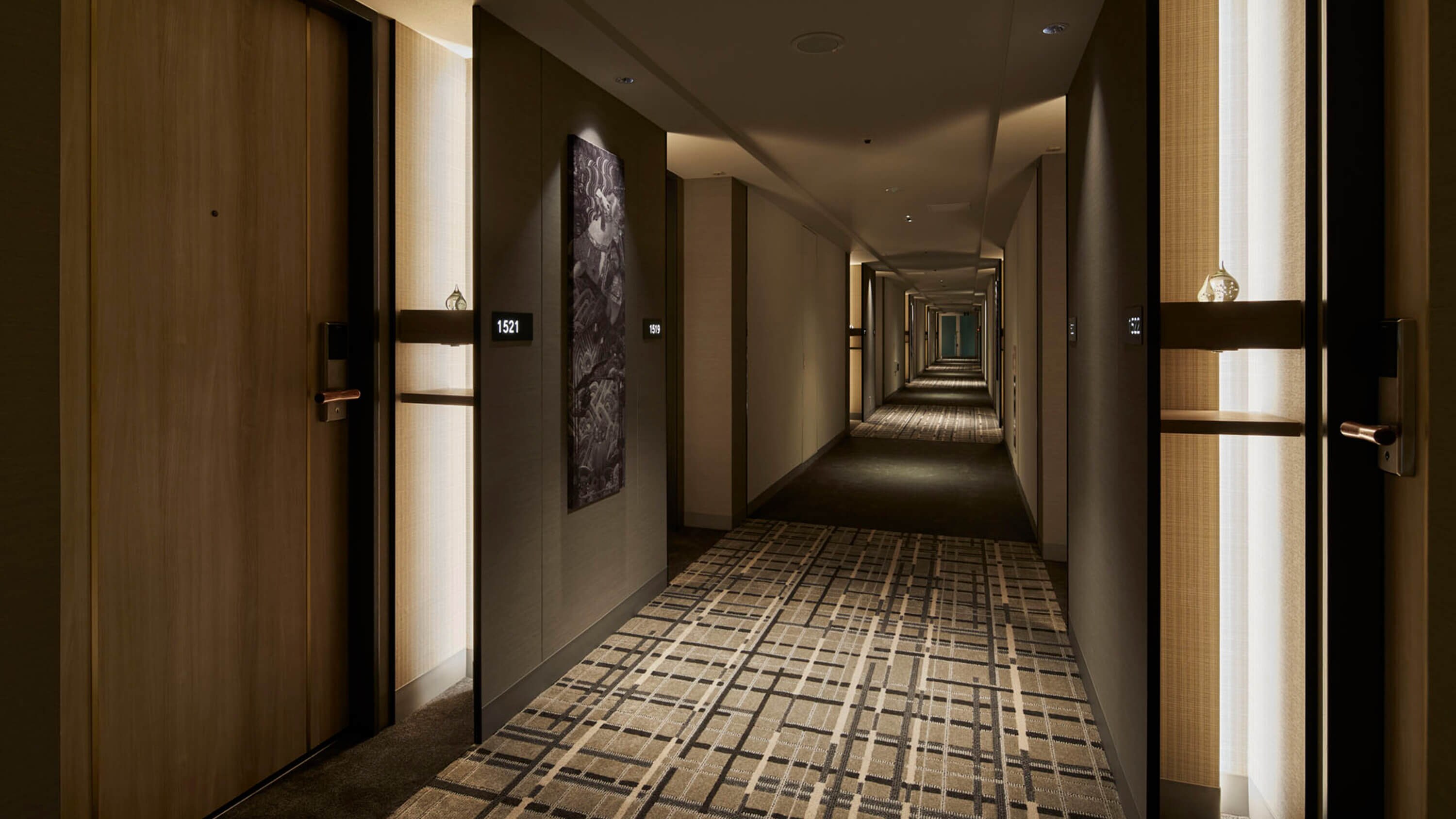 Corridor on the guest room floor "The walls are decorated with photo panels of traditional Kyushu scenery"