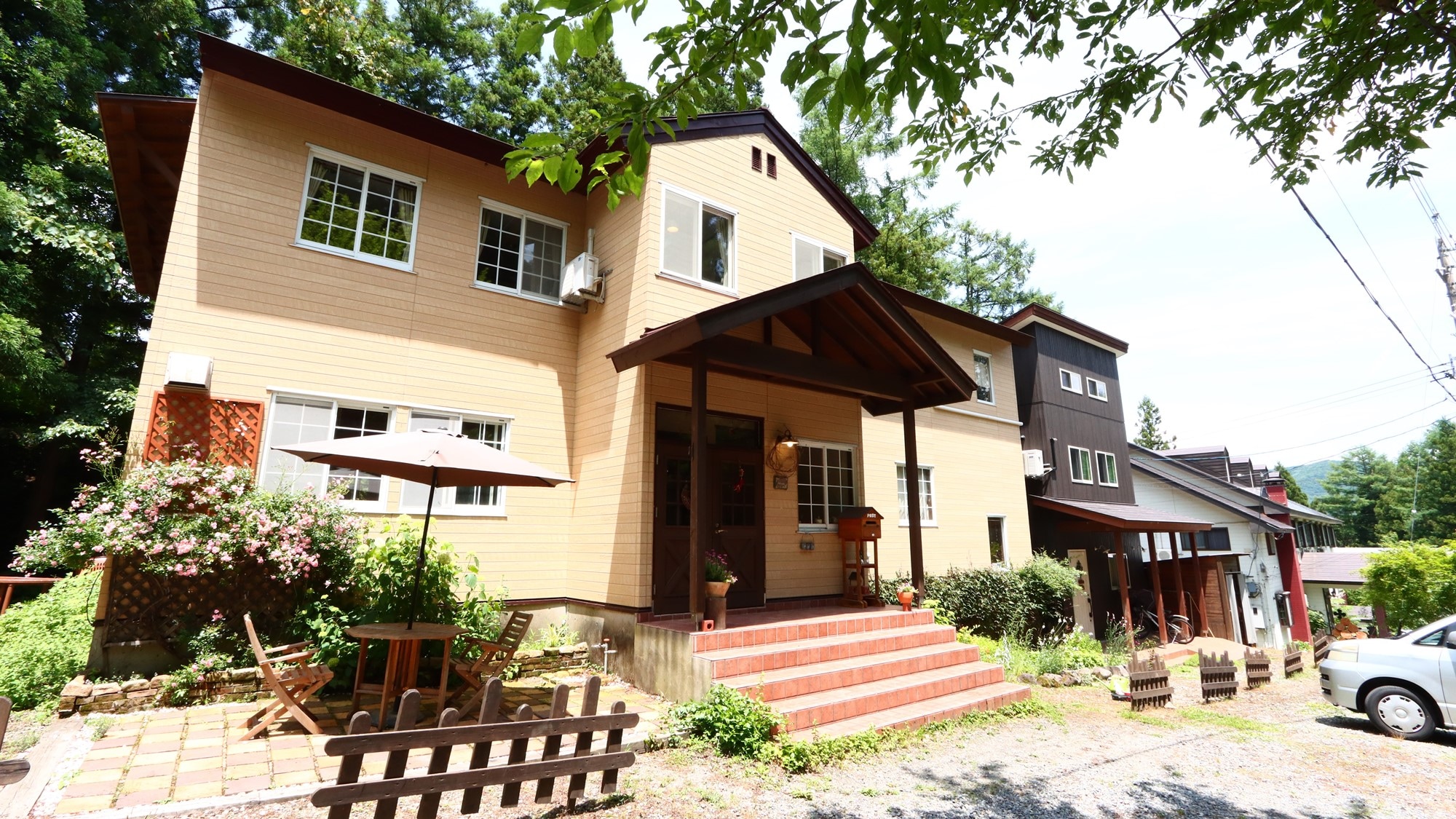 Exterior: A pension located on the side of the Goryu ski slope surrounded by cool greenery.