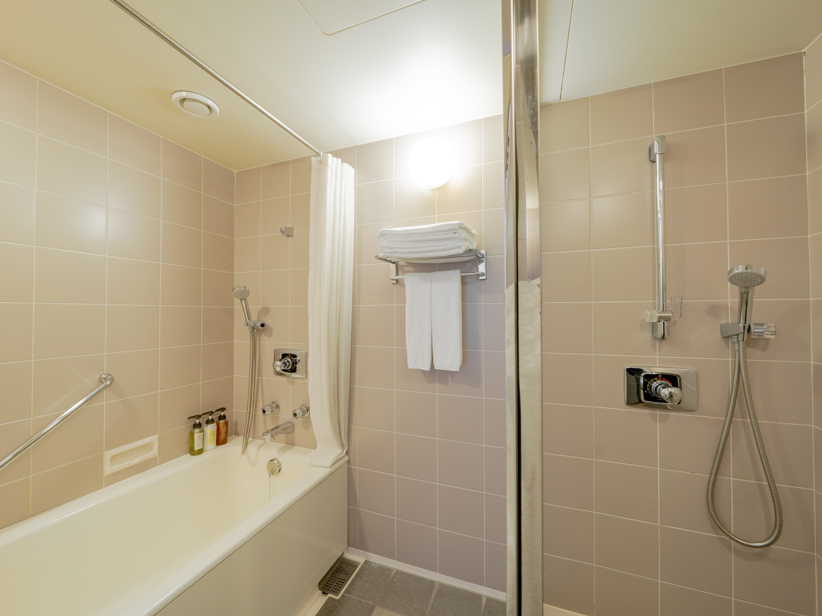 Bathroom with shower booth for both comfort and functionality