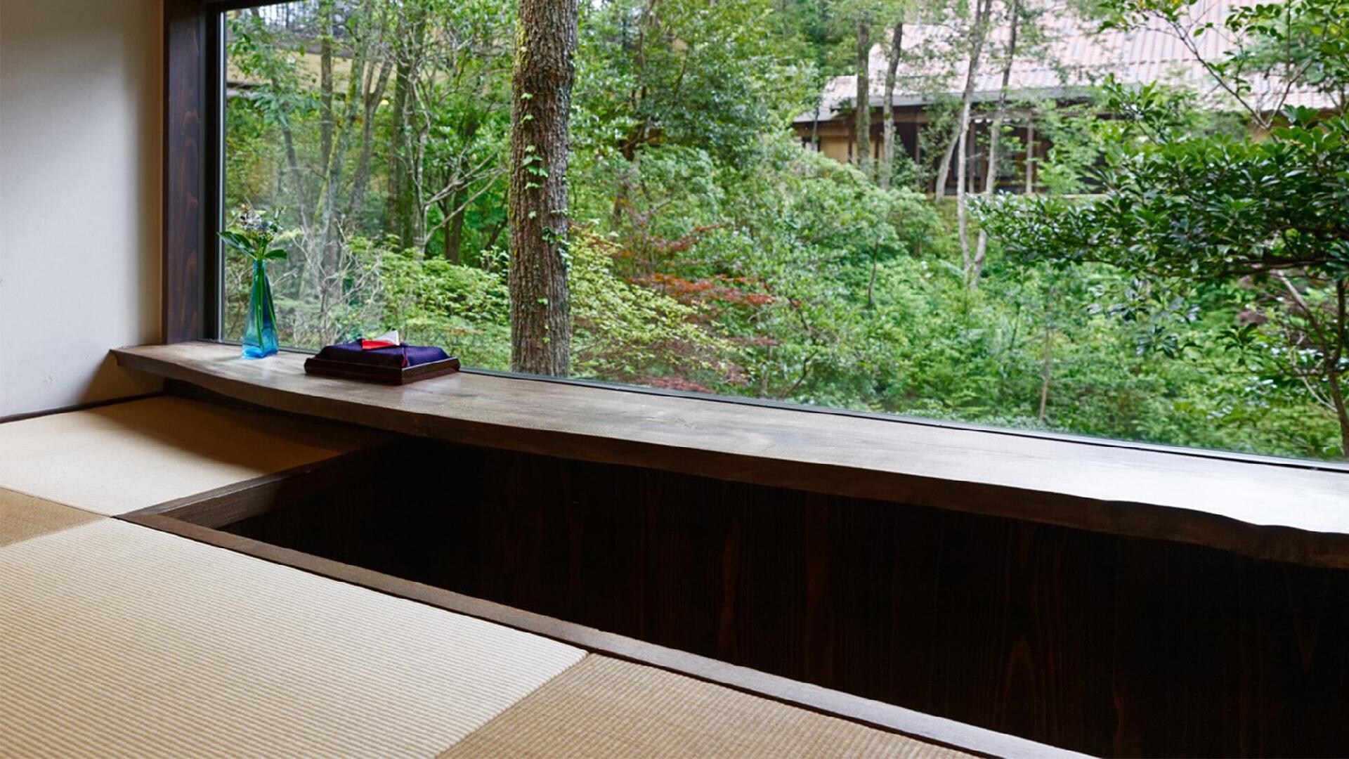 Main building Japanese-style room "Asobi" with a large window overlooking the nature of the four seasons