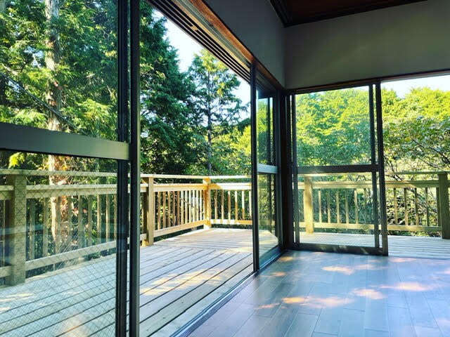 Large windows overlooking the greenery