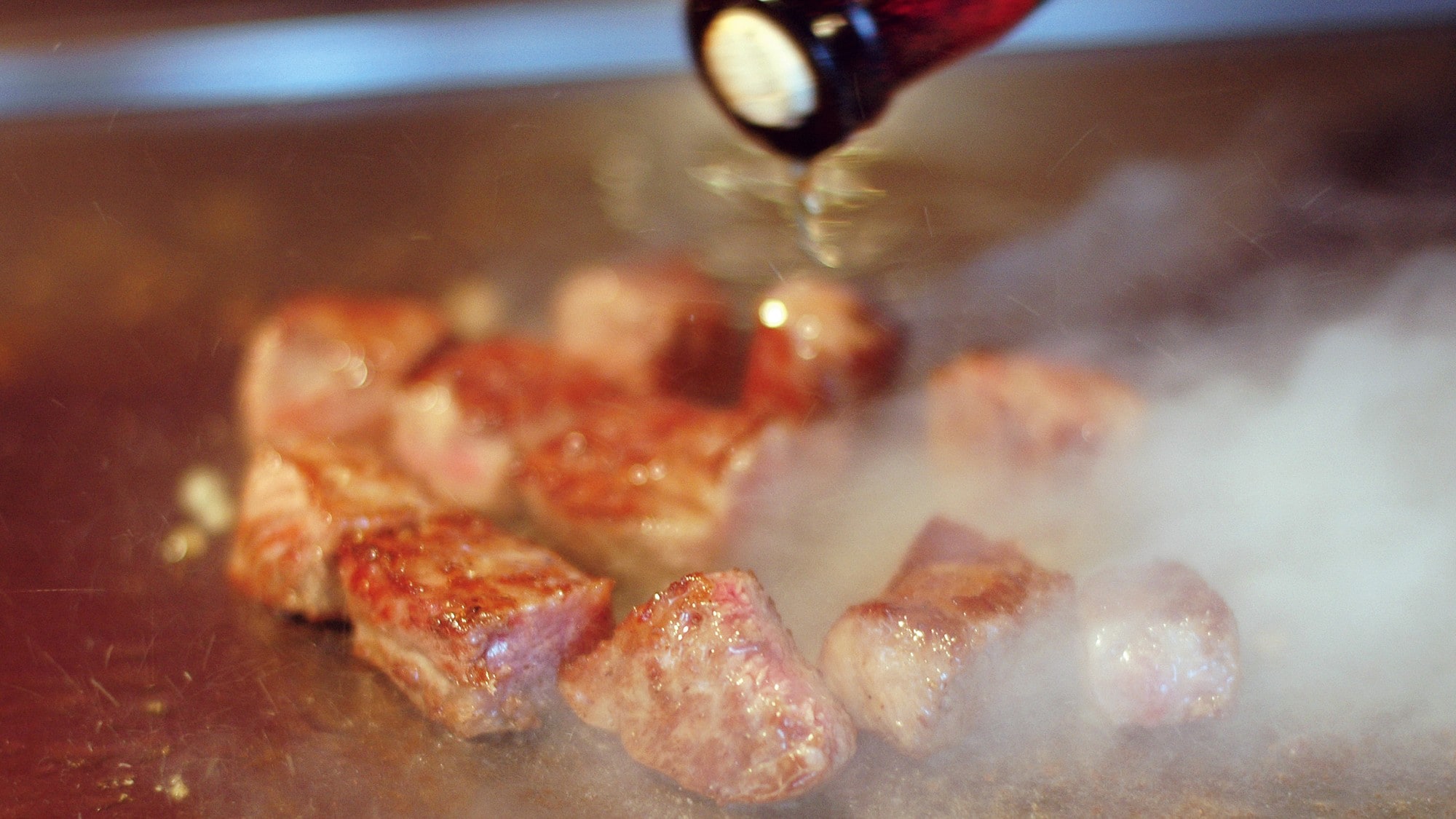 Enjoy juicy meat cooked on a teppanyaki grill.