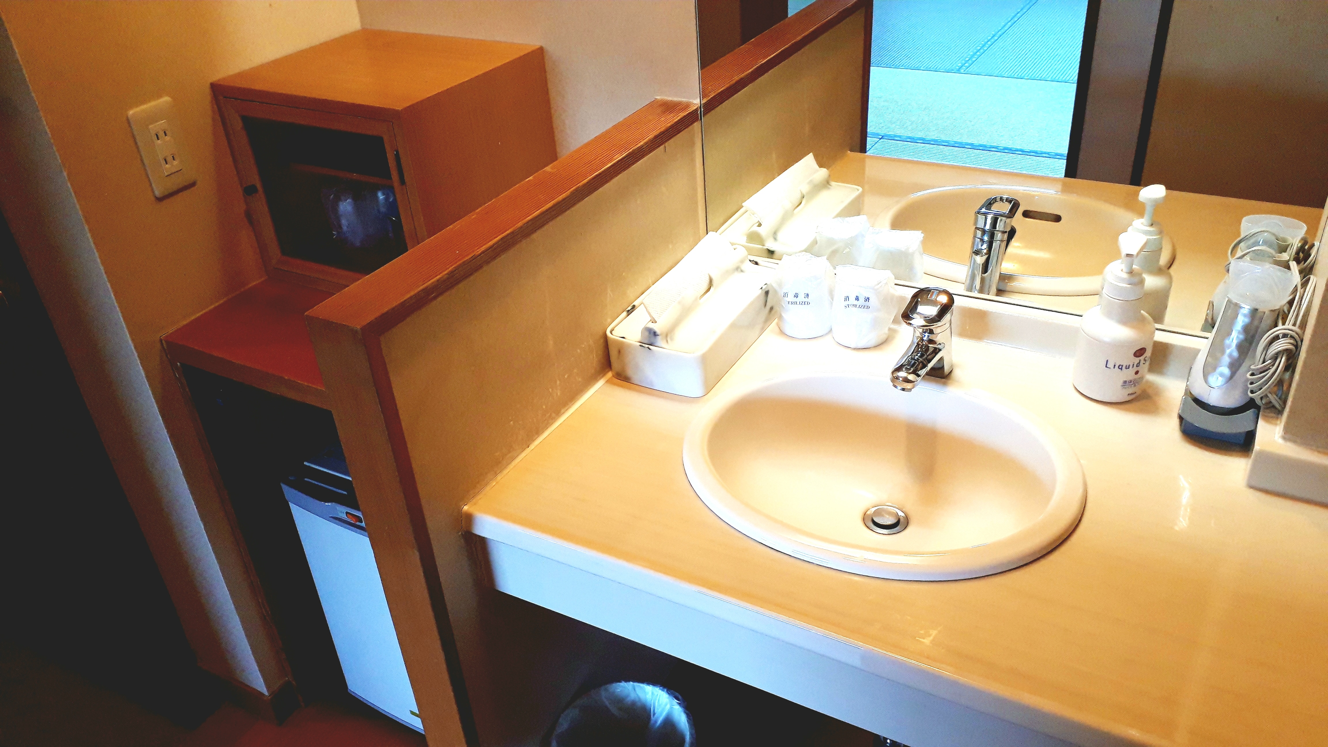 Japanese-style room with open-air bath with garden