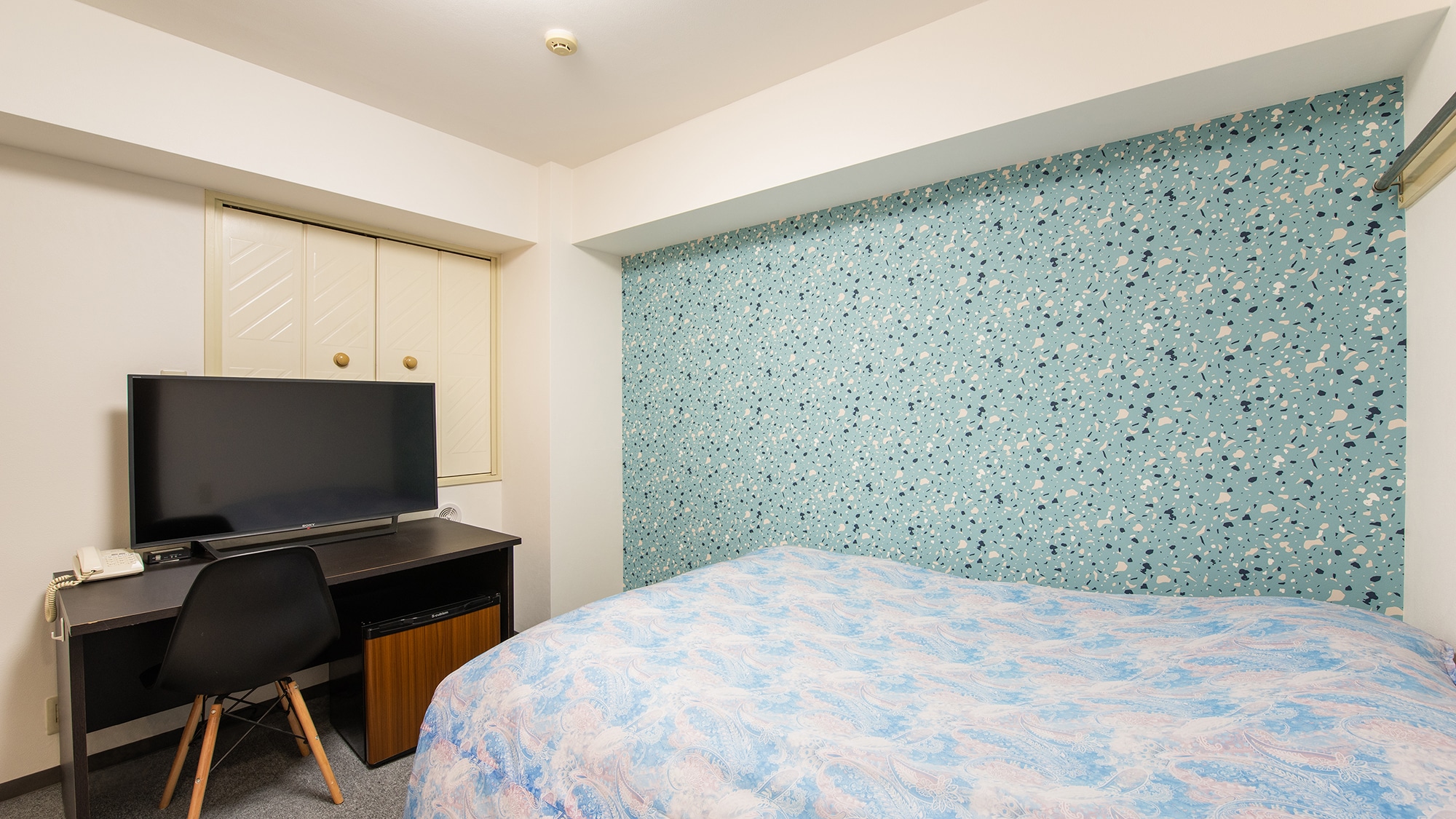 Separate bathroom and toilet. The wallpaper is cute too.