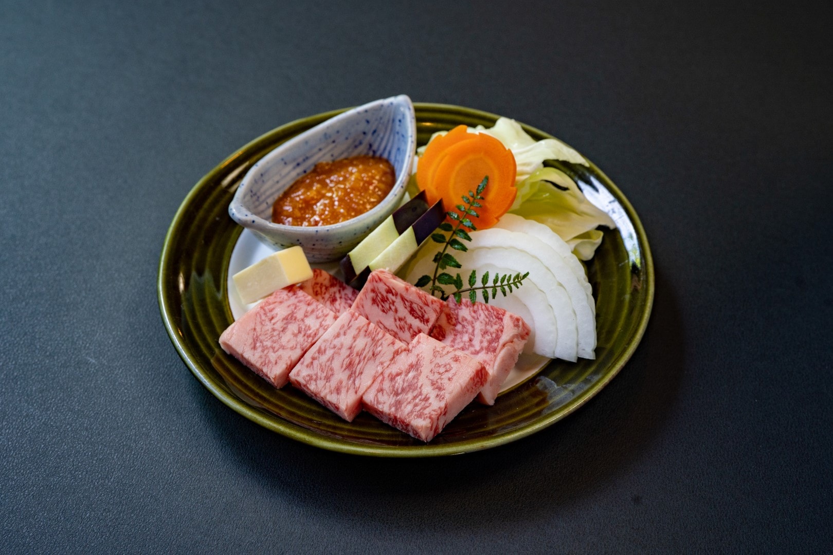 Top quality A5 rank Hida beef sirloin steak cooked on charcoal magnolia leaves