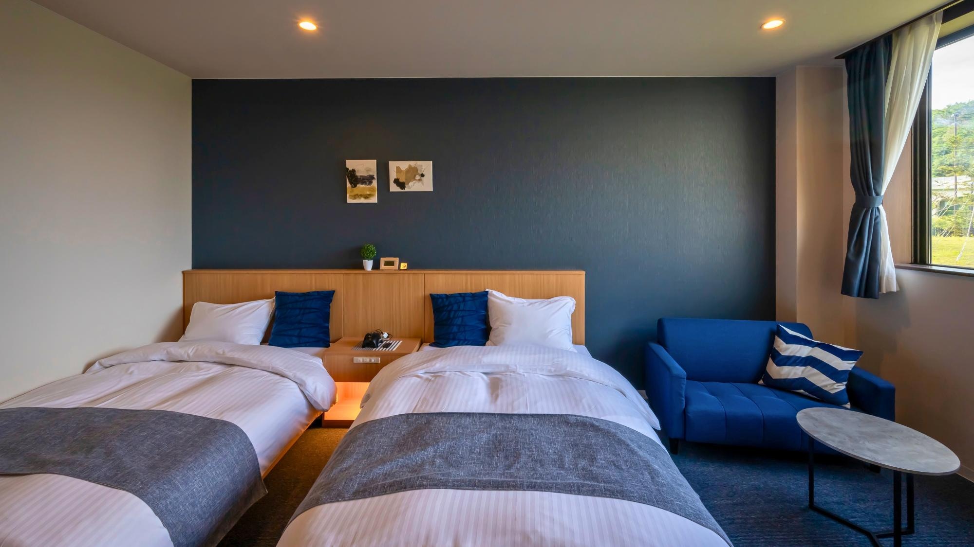 This room comes with two semi-double beds and a mini sofa set, and is also recommended for couples. Comfort Twin Room