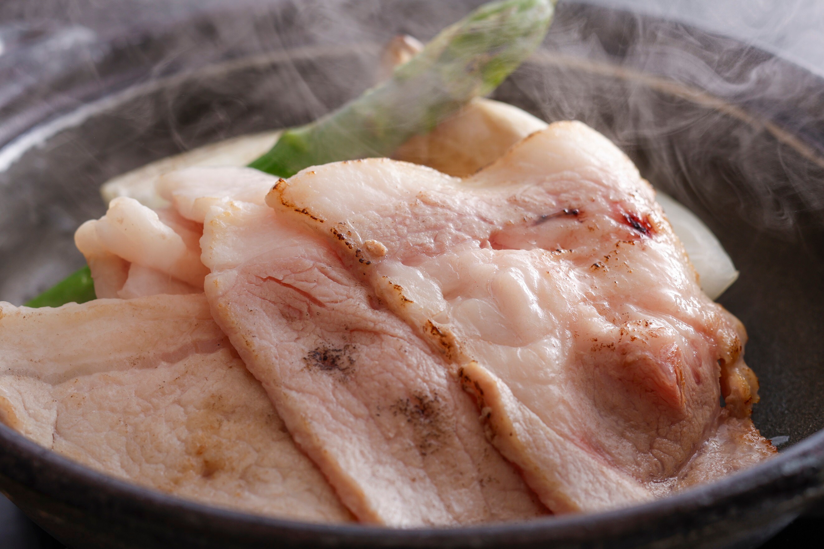 Example of a seasonal kaiseki meal for summer 2026 (Grilled domestic pork loin on a ceramic plate)
