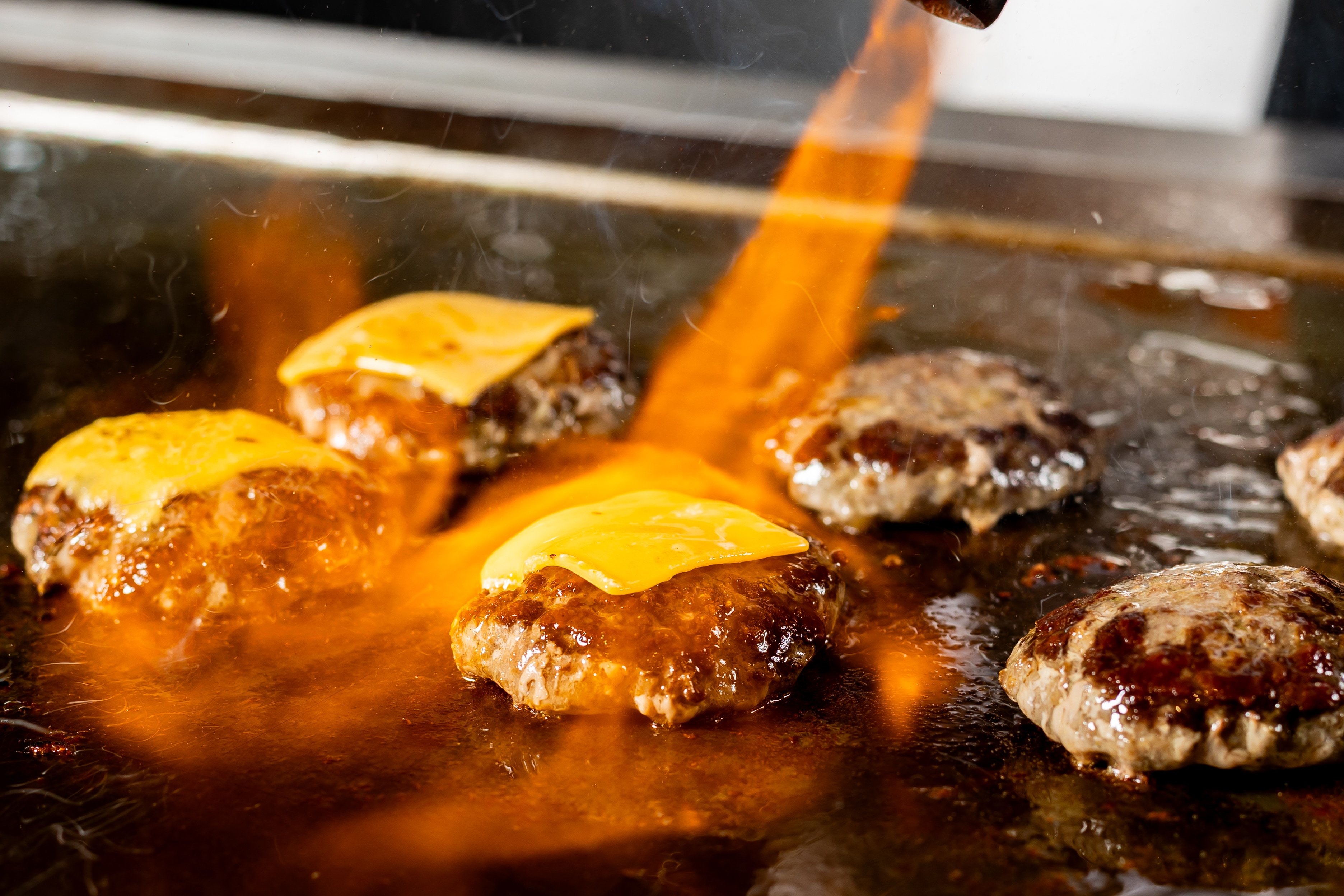 Hamburgers grilled in the live kitchen