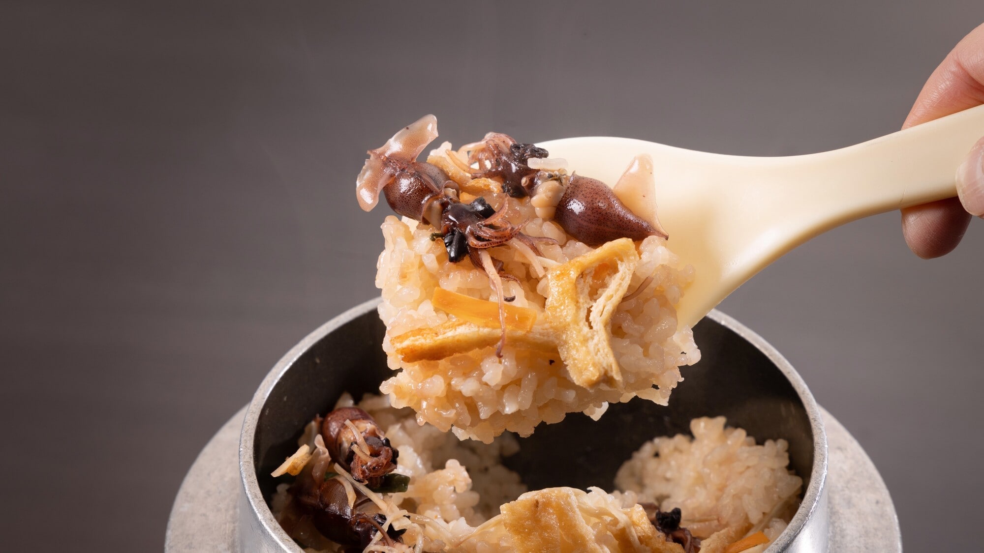 Firefly squid course: rice cooked in a pot