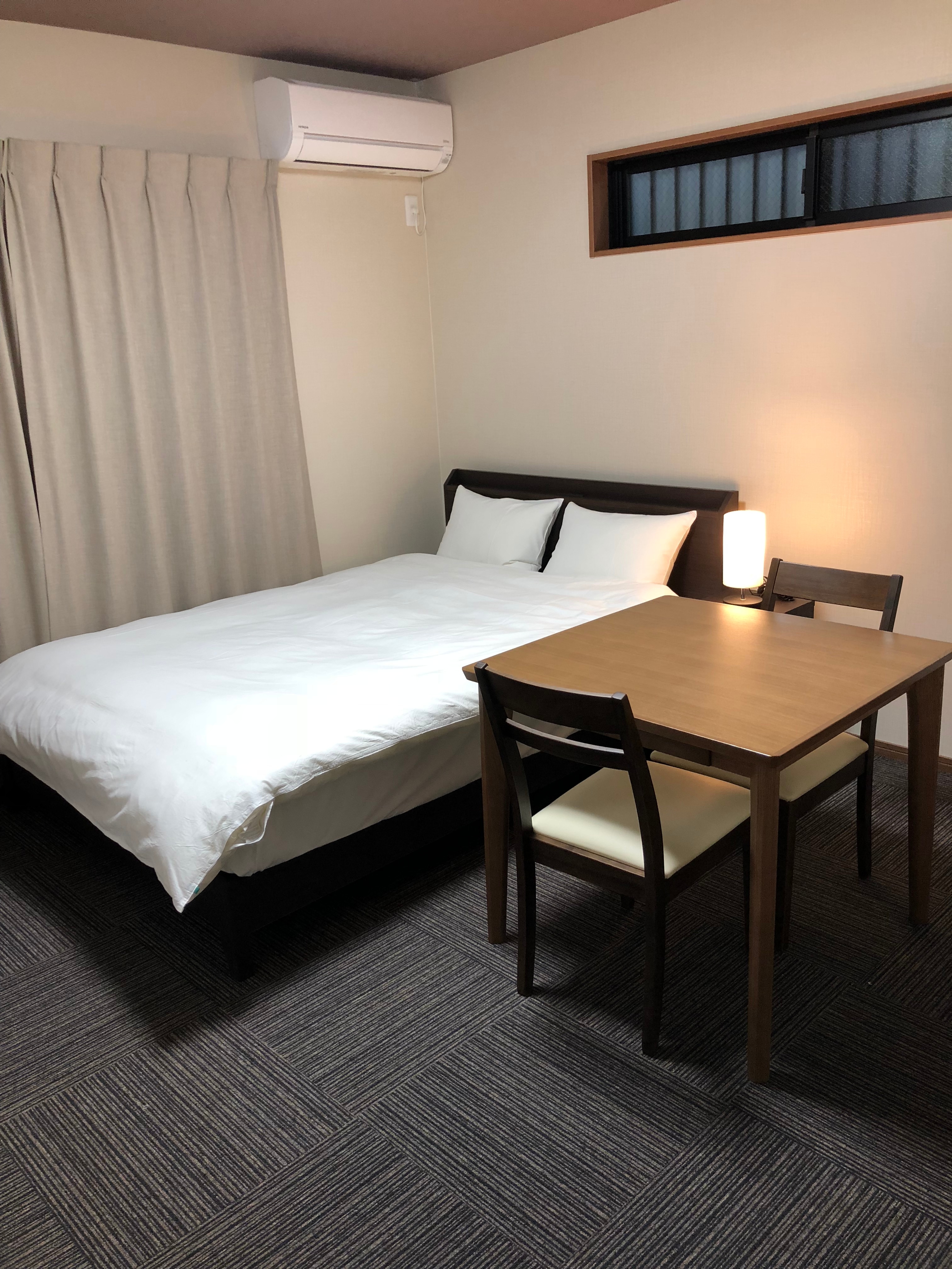 Bed and table on the first floor