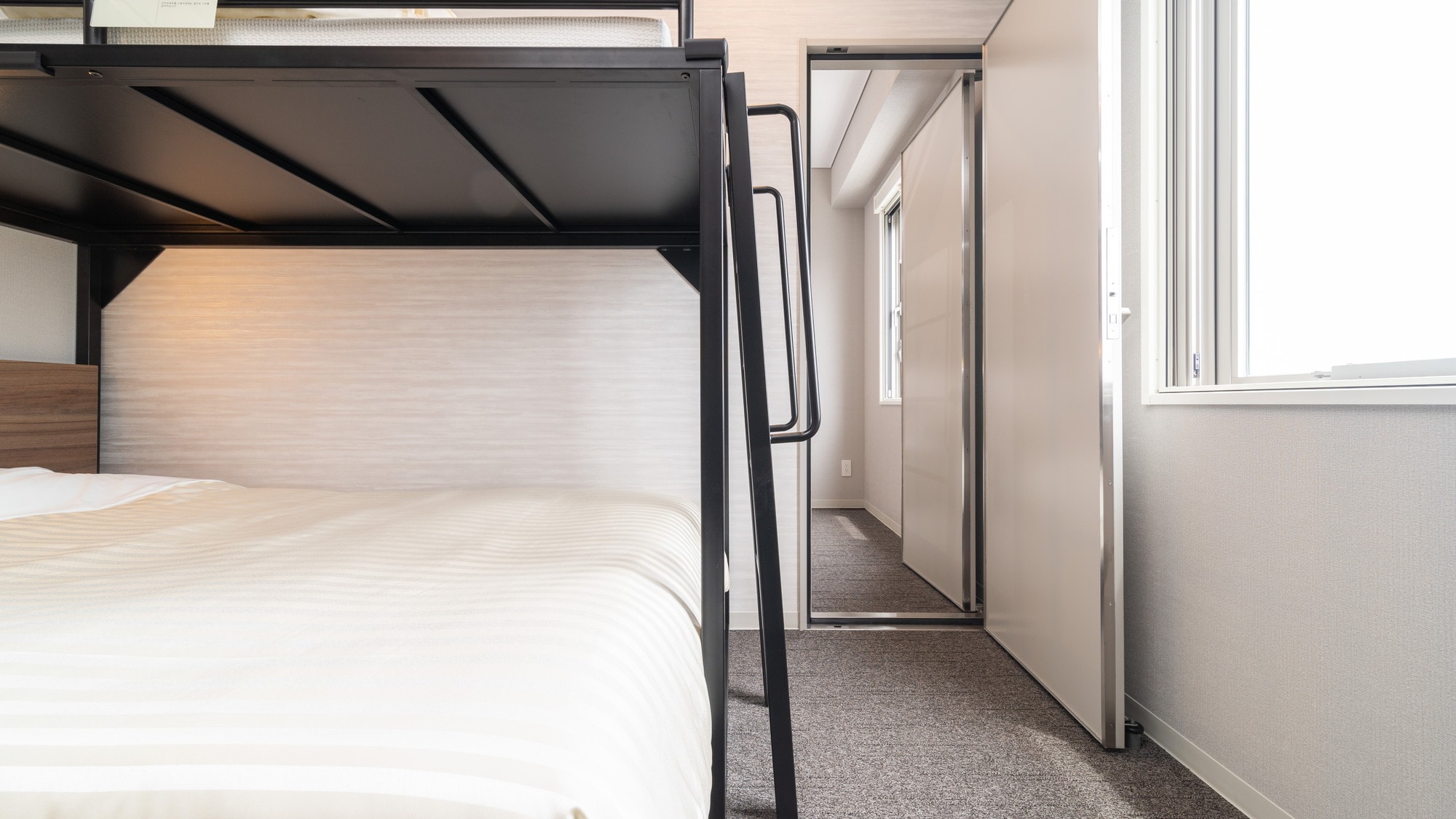 This room has two rooms with a door between them.