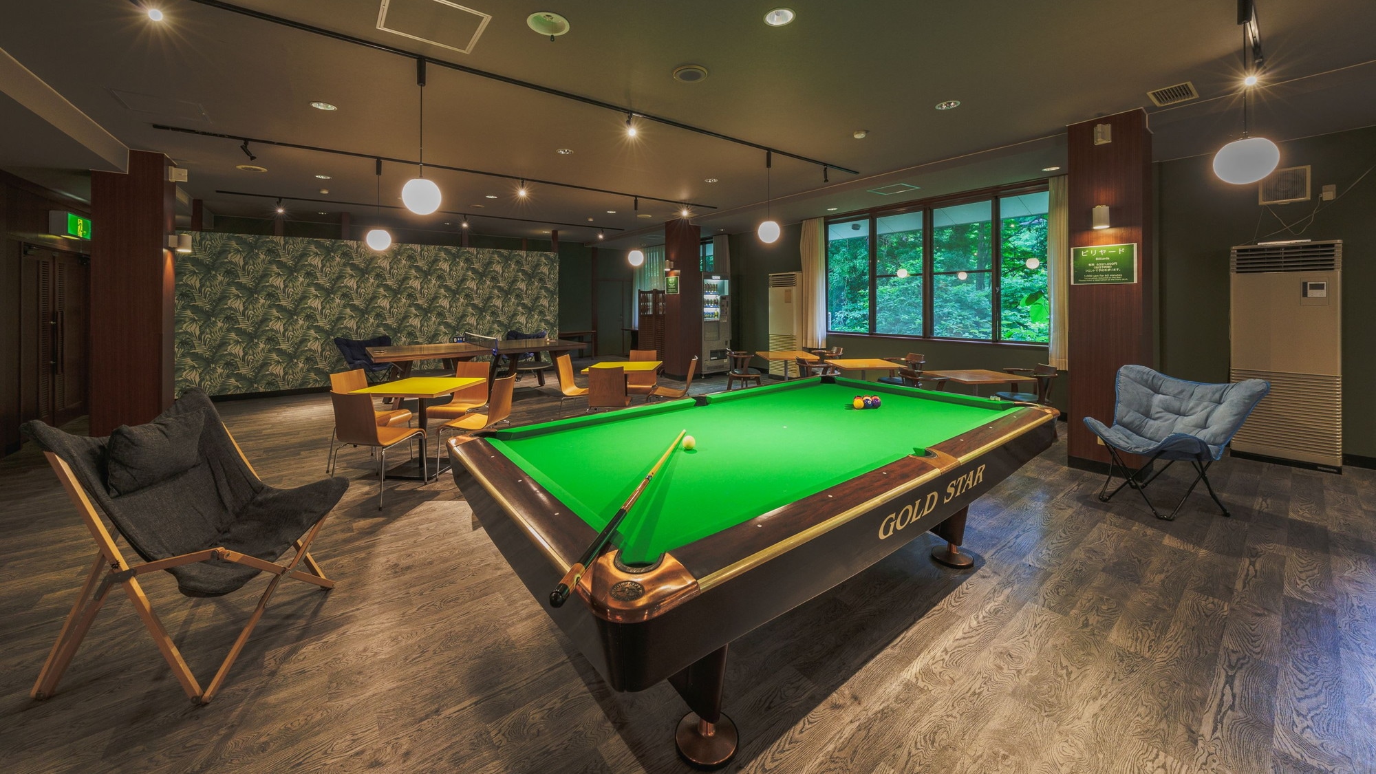 [Lounge TLJ] A renovated lounge equipped with a kitchen space, power outlets, a ping pong table, and a dining table.