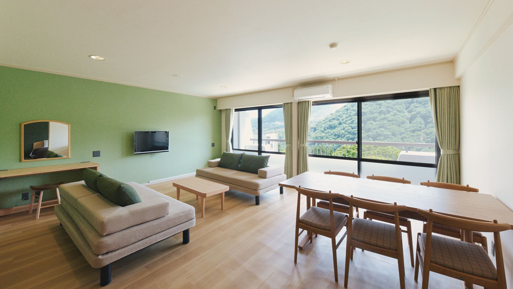 [Deluxe Room] This room offers a spacious and open feel with plenty of natural light (example).