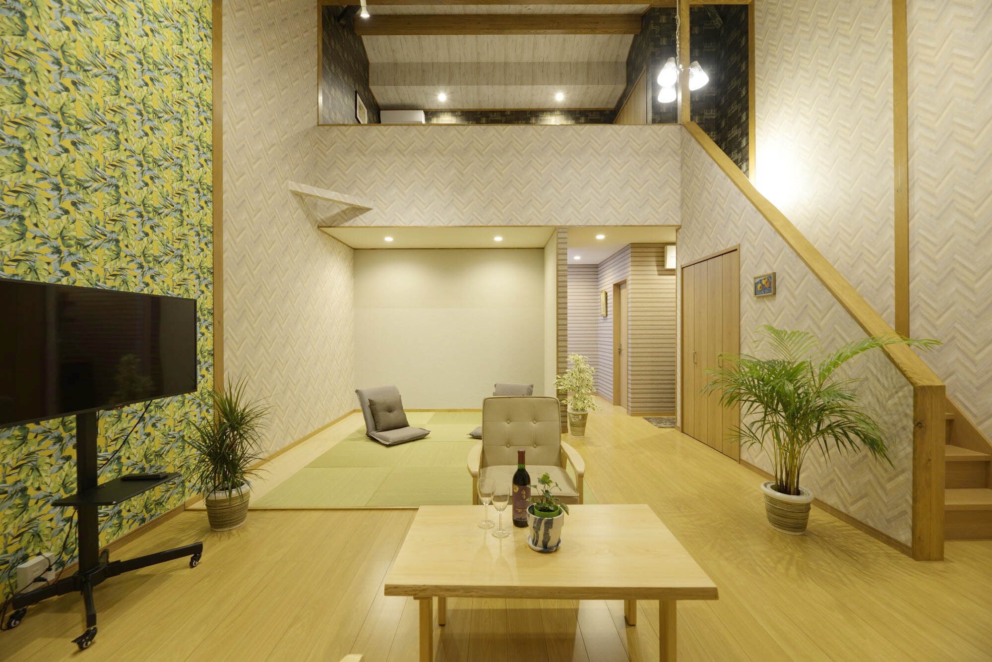 A spacious open-ceiling living room (Re-Suite)