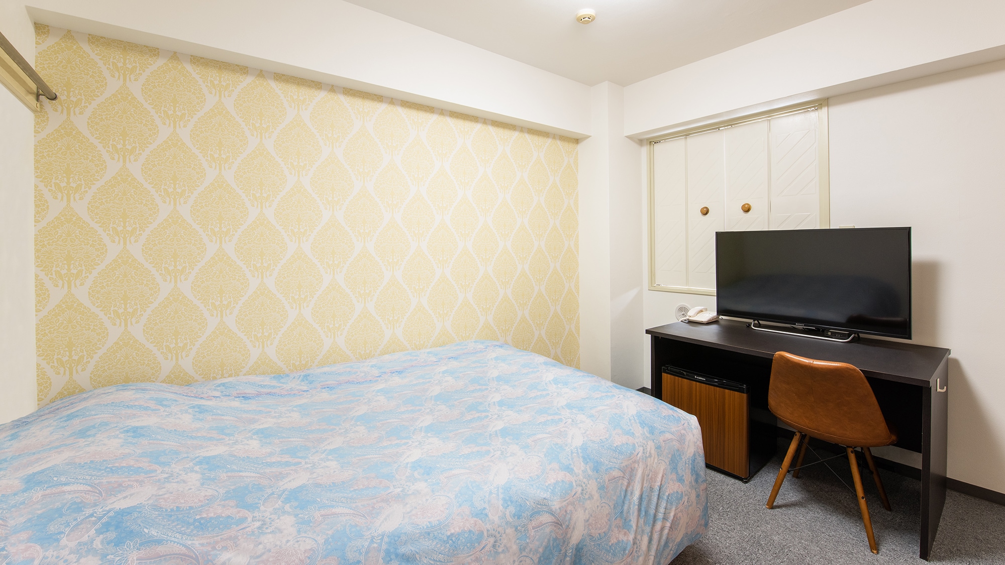 Separate bathroom and toilet. The wallpaper is cute too.