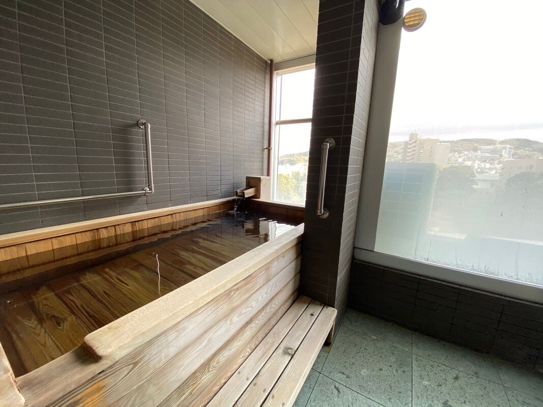 Premium room with cypress bath flowing from the source