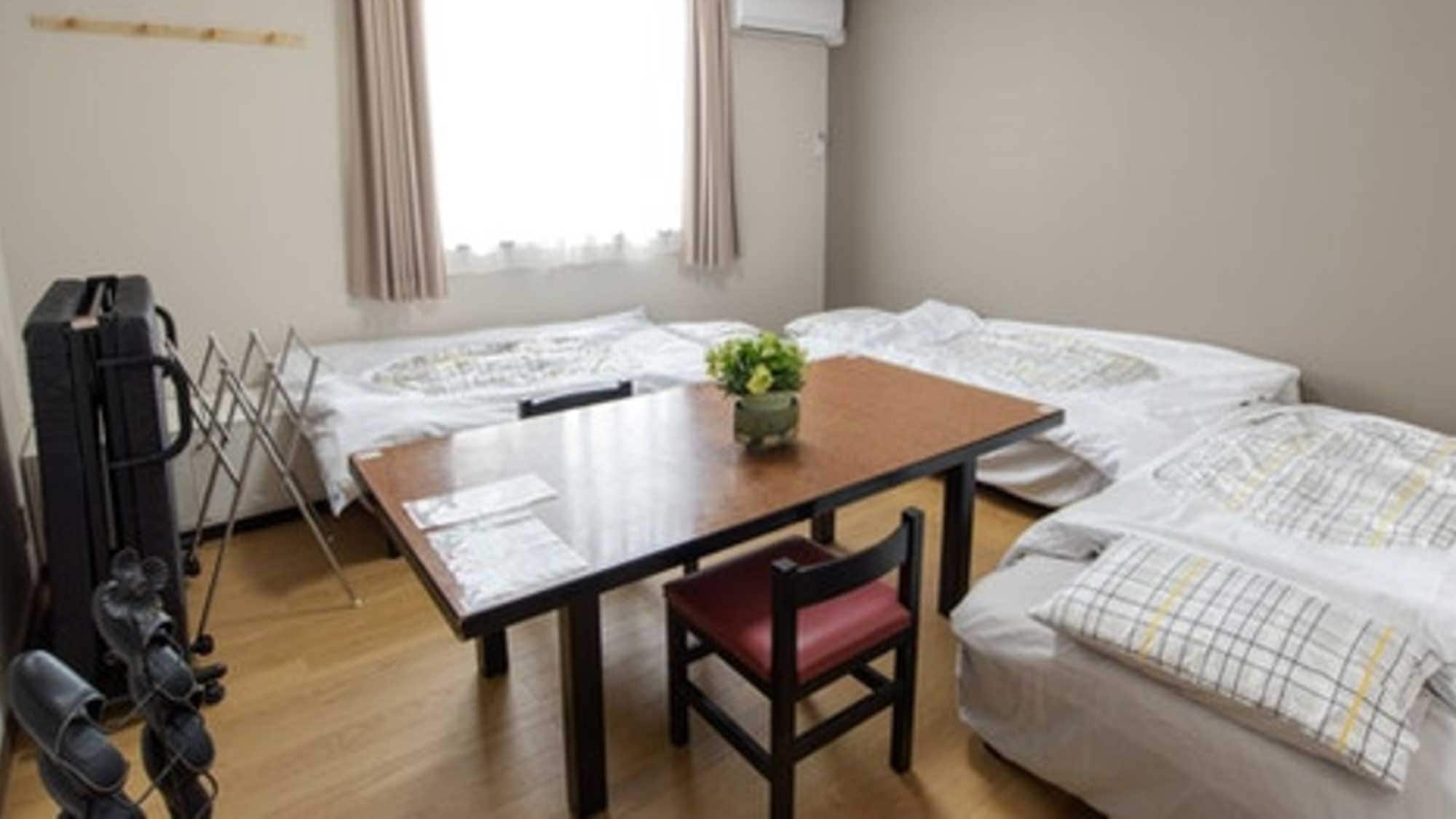 ・Room 3: 4 single beds, perfect for groups