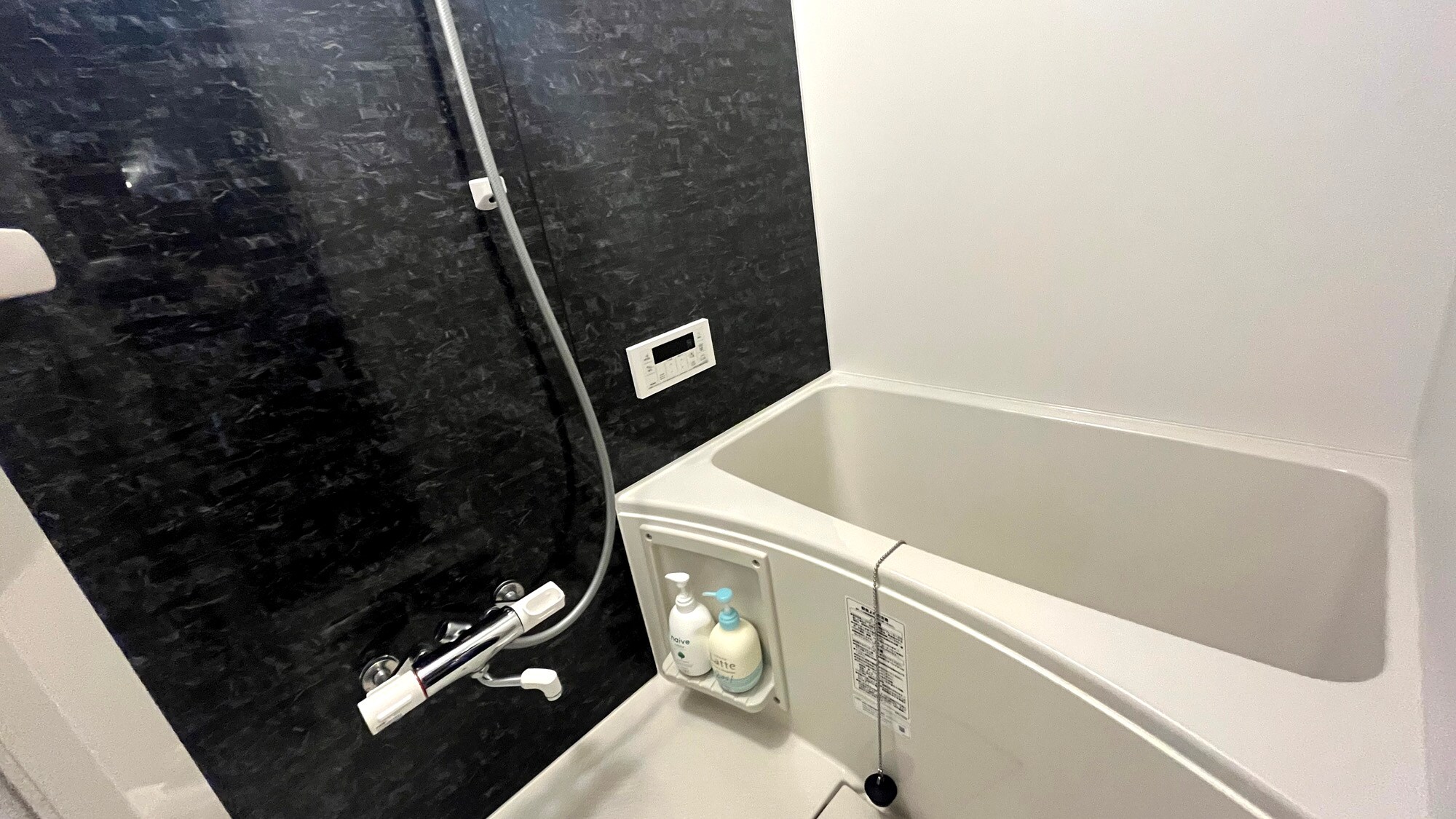 This renovated room comes with a bath. Perfect for those who value their privacy.