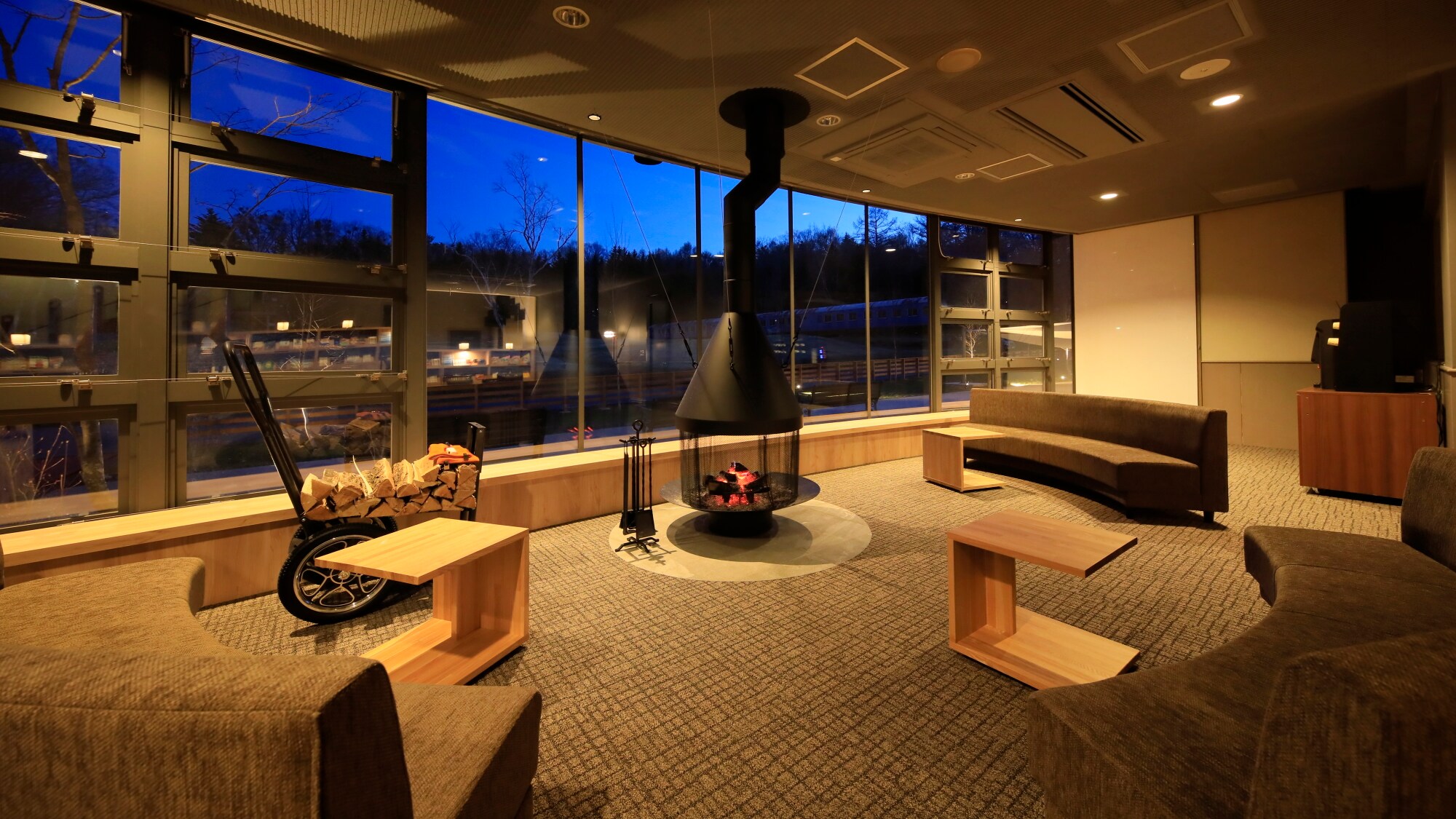 Lobby - At night, the fire in the fireplace provides a warm glow.