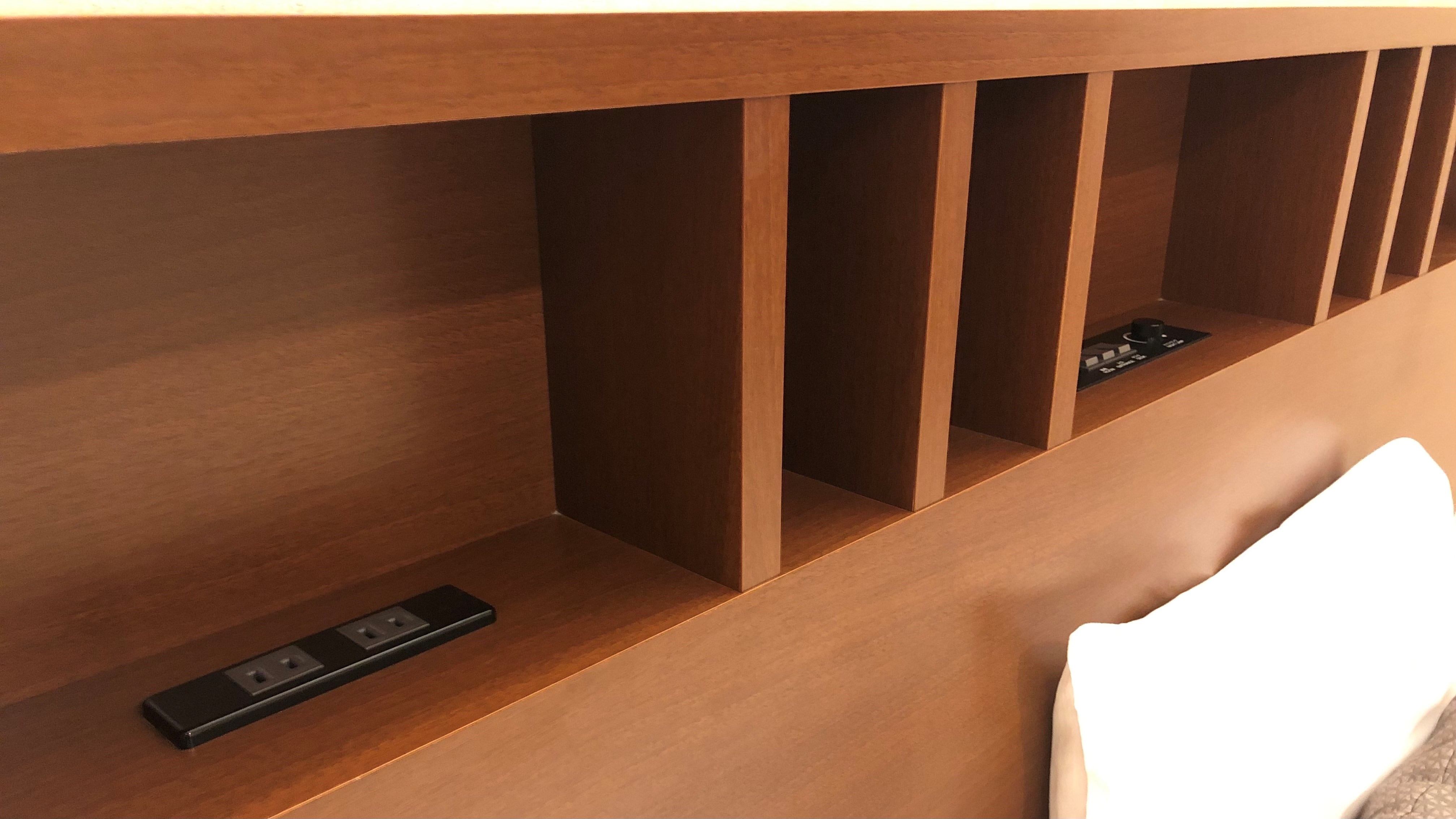 There is also an outlet next to the pillow!