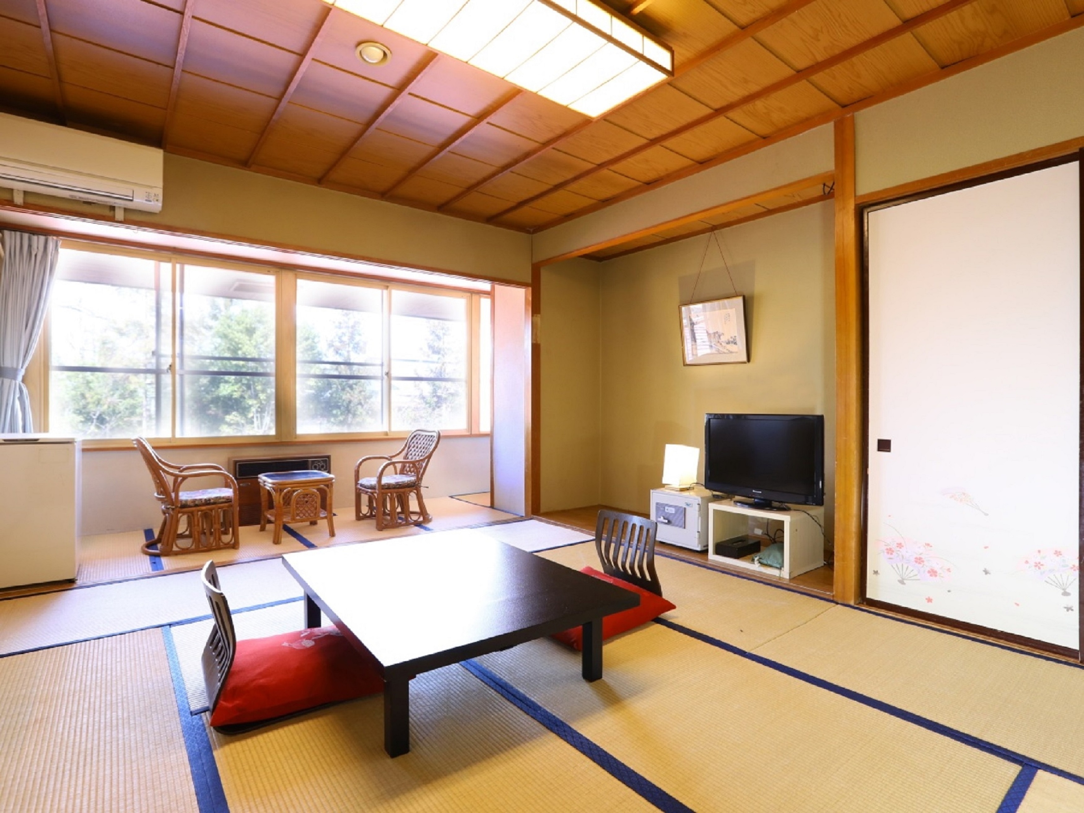 This room has a bath and toilet in the main building.