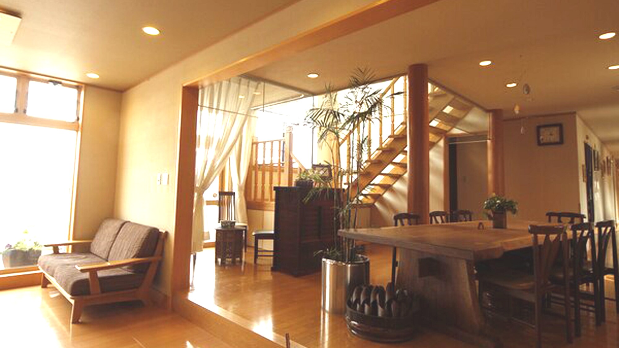 Relax at the "gathering table" in the hall, inside the warm wooden building.