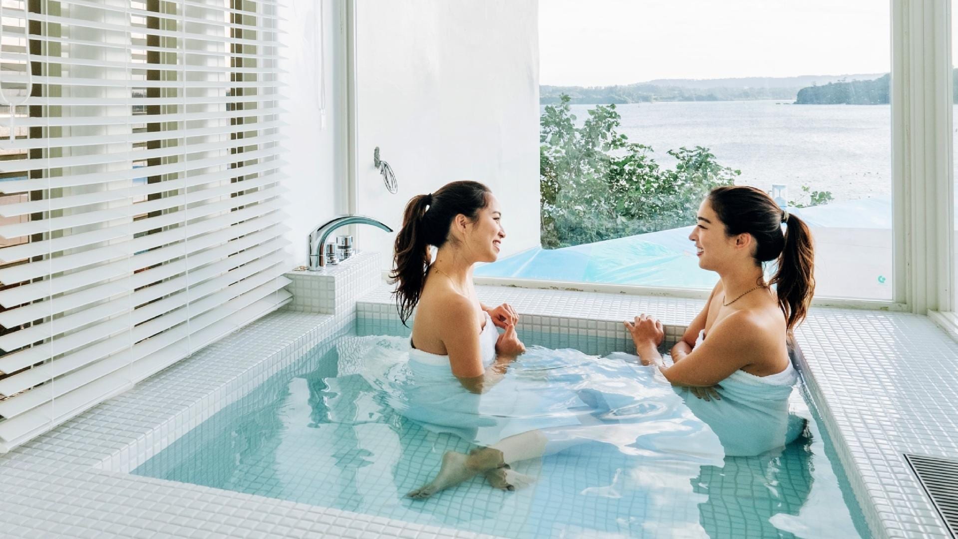 You can see the sea from the bath in your room.