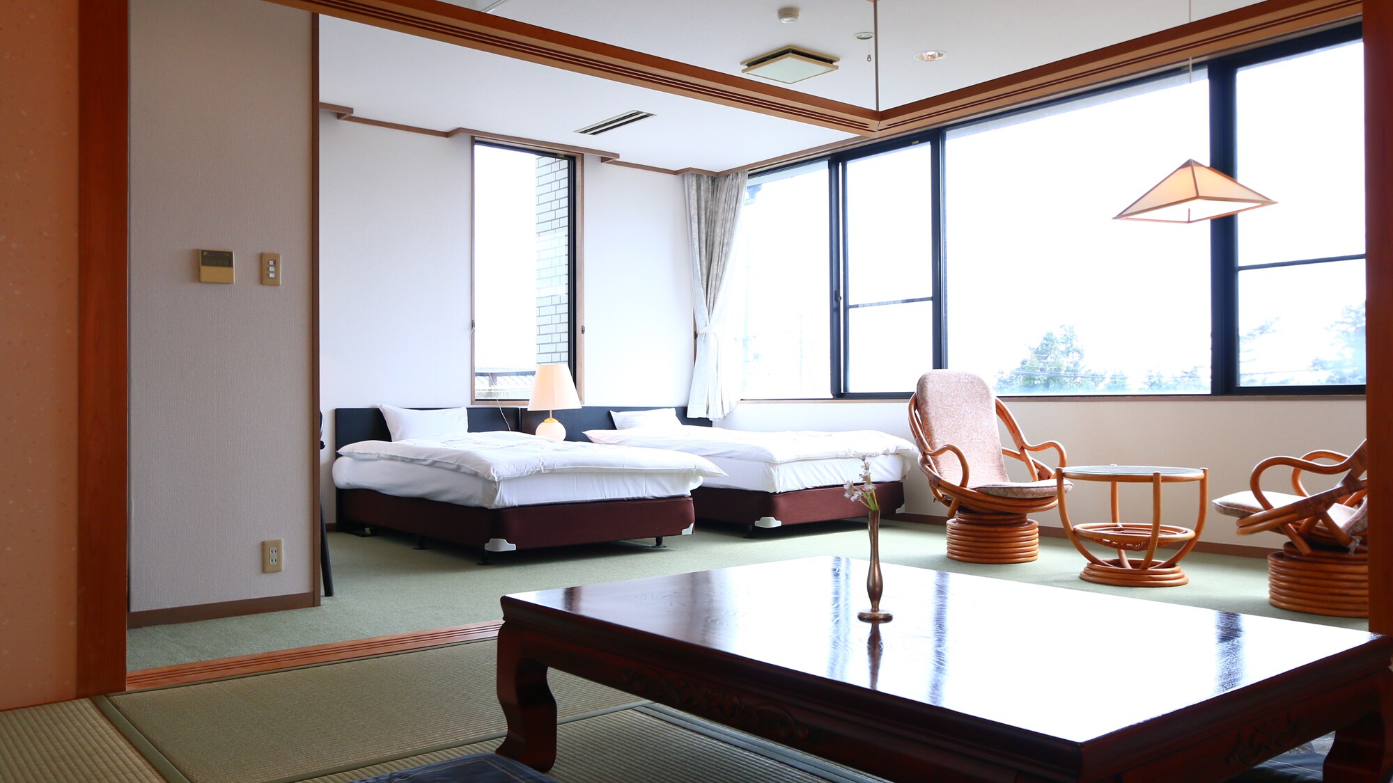 A Japanese-Western style room with a panoramic view of Lake Biwa.
